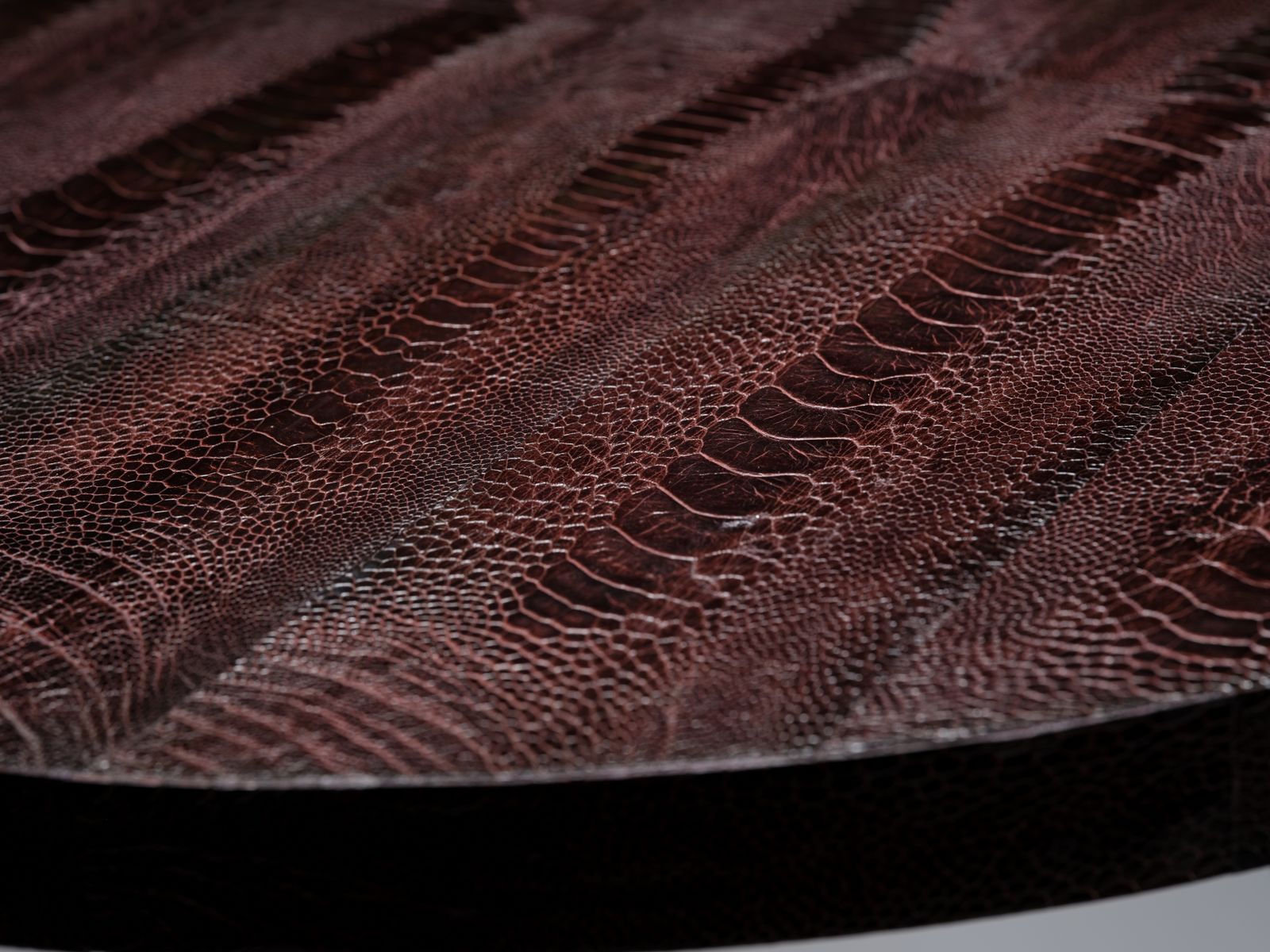 photo buy Unique And Rare Aubergine Hand Dyed Boa Constrictor Snakeskin Table Resting On Black Hand Laced Leather Legs, South Africa Circa 1980's.