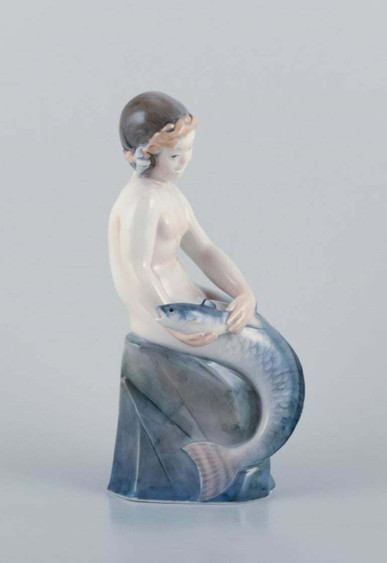Royal Copenhagen, Rare Porcelain Figurine Of A Mermaid With Fish In Her Hands photo furniture