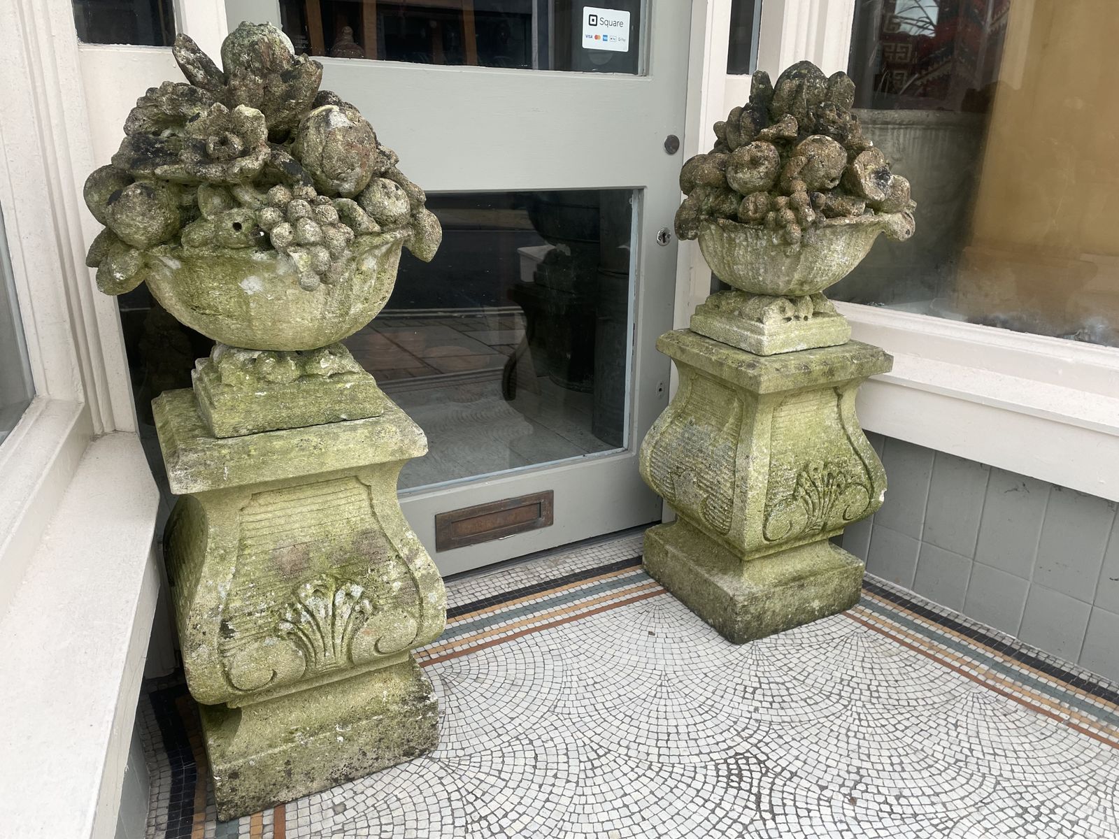 Large Pair Of Antique Hand Carved Stone Fruit Basket Urns  On Their Original Decorative Solid Stone Plinths