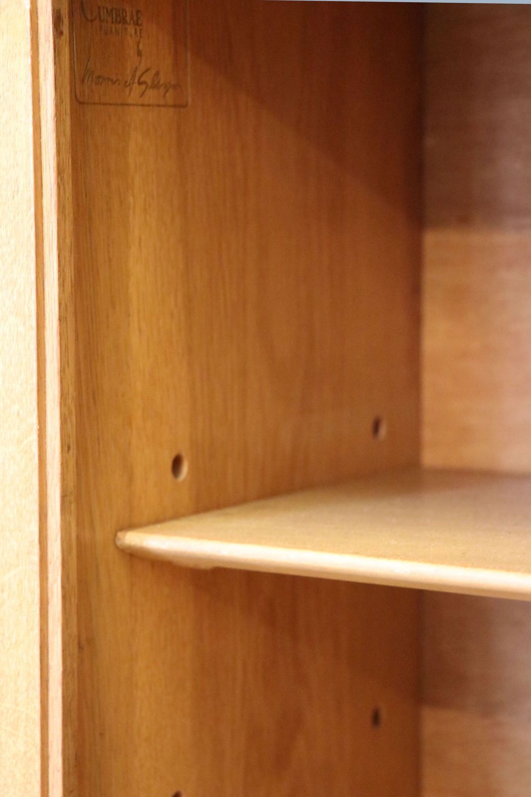photo furniture A Mid Century Oak Bookcase Cabinet, Later Sign Written For Associated Television.