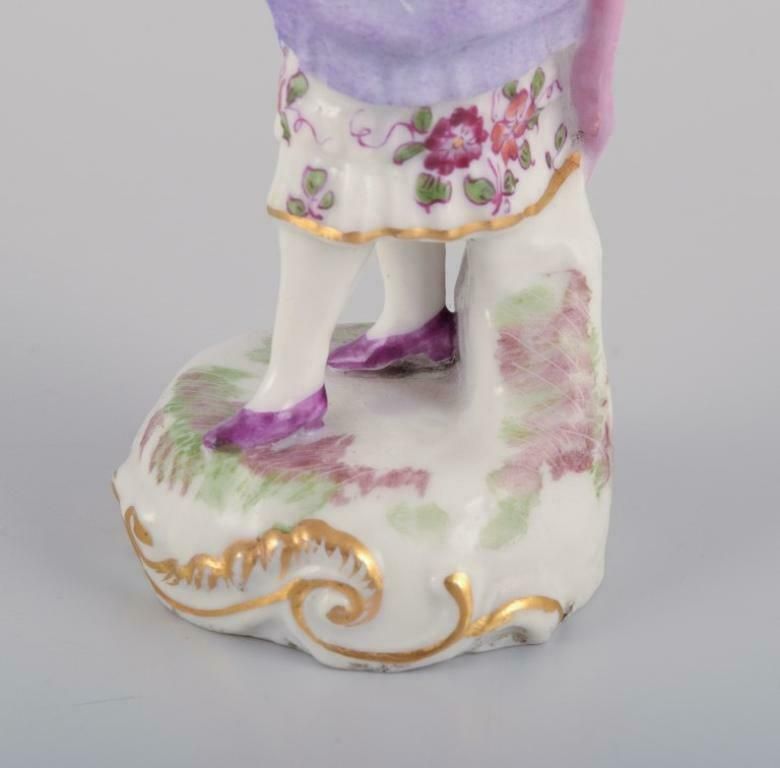 Antique German Porcelain Figurine. Young Woman In Elegant Attire. photo vintage