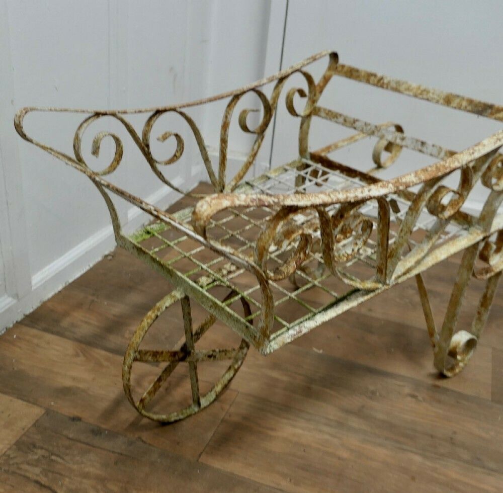 Wrought Iron Hand Cart Wheel Barrow For Plant Display photo 450.0