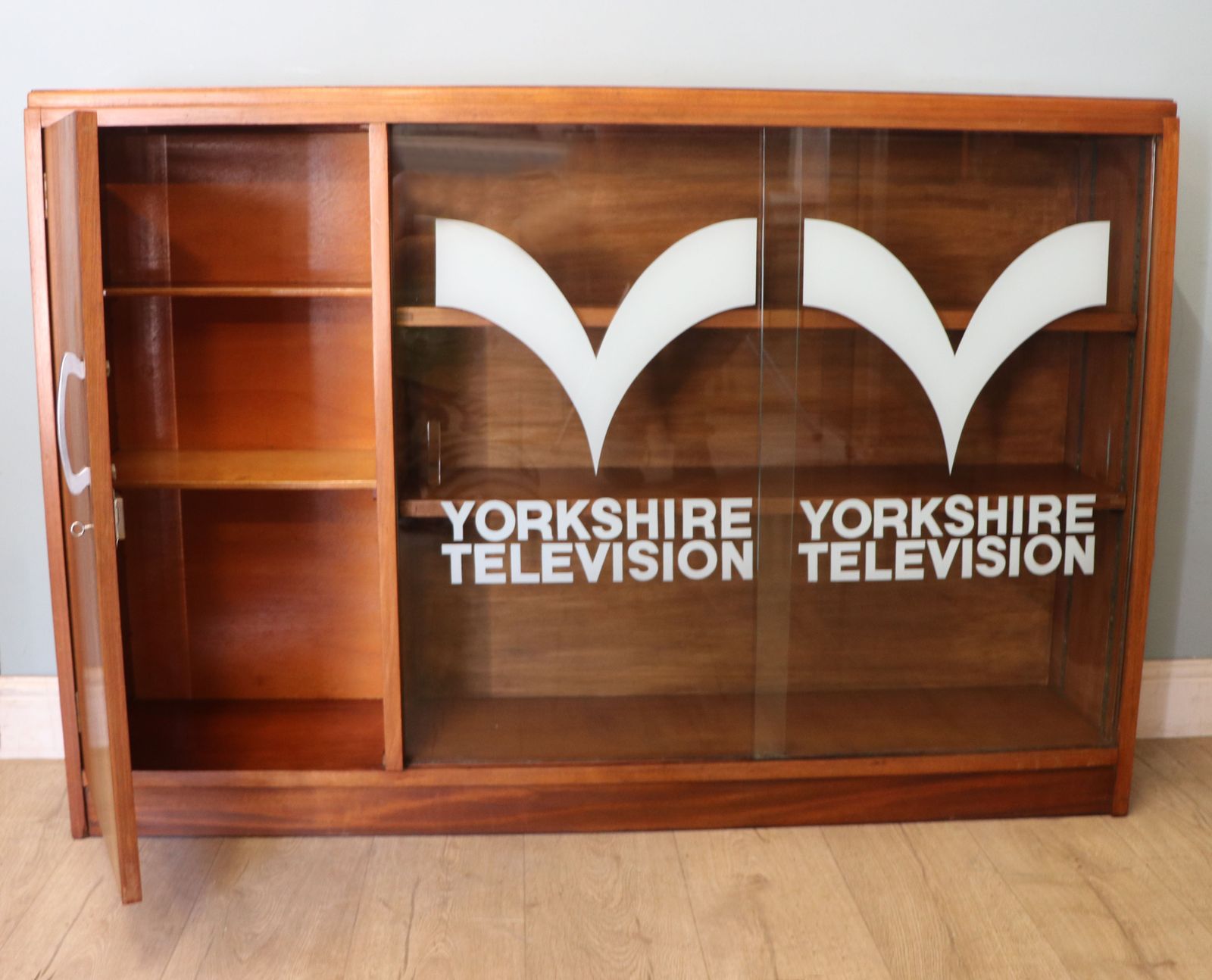 A  Mid Century Retro Style Display Cabinet By Cresta, Sign Written Yorkshire Television. photo Furniture