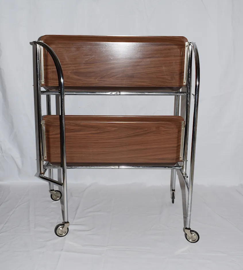 Furniture A Mid Century Bremshey & Co German Dinette Trolley. Made Of Chrome & Lamented Wood. It Folds Into A Smaller Frame. Attribution Mark On The Wheels. photo