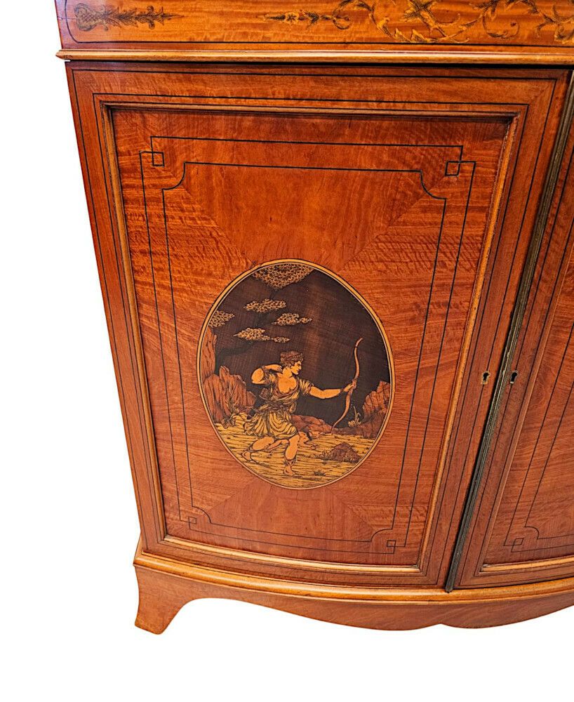 photo furniture A Very Fine Edwardian Marquetry Inlaid Bowfronted Bookcase In The Manner Of Edward And Roberts