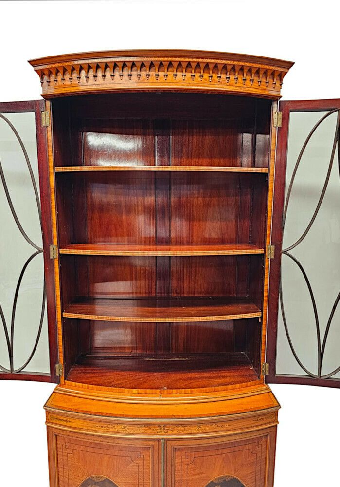 photo vinterior A Very Fine Edwardian Marquetry Inlaid Bowfronted Bookcase In The Manner Of Edward And Roberts