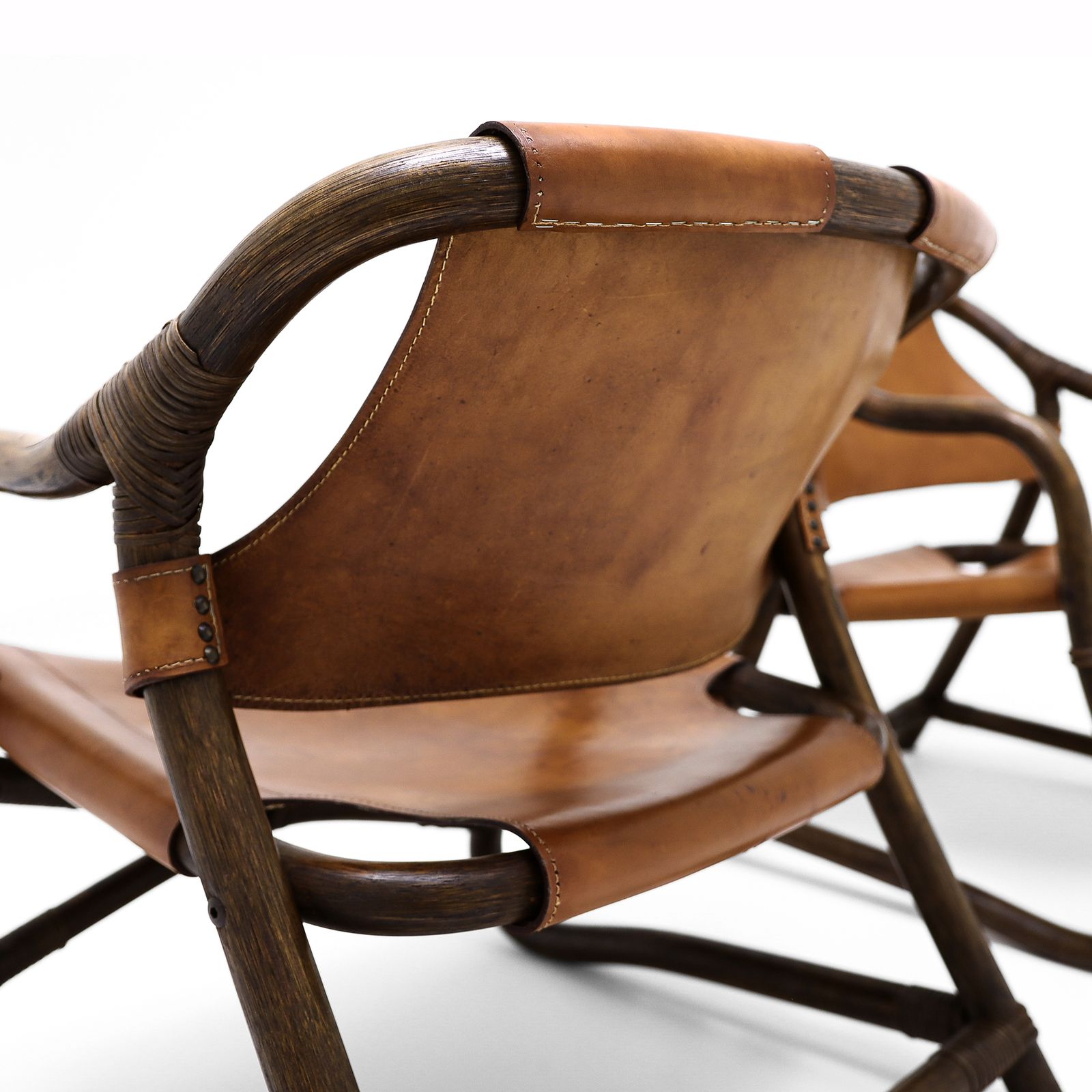 1250.0 A Pair Of Vintage Sheepskin And Leather And Cane Easy Chairs Attributed To Rohe Noordwolde photo
