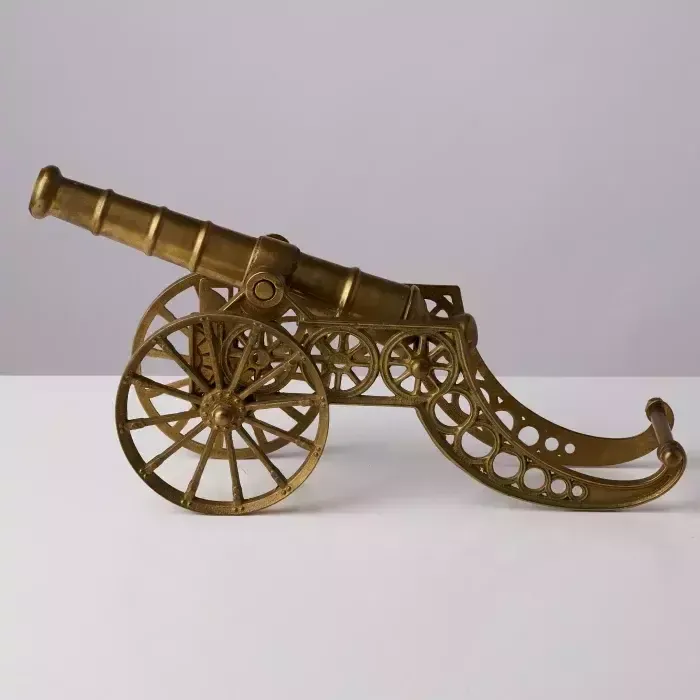 Tabletop Gun. Model Of Weapons From The 17th Century. photo furniture