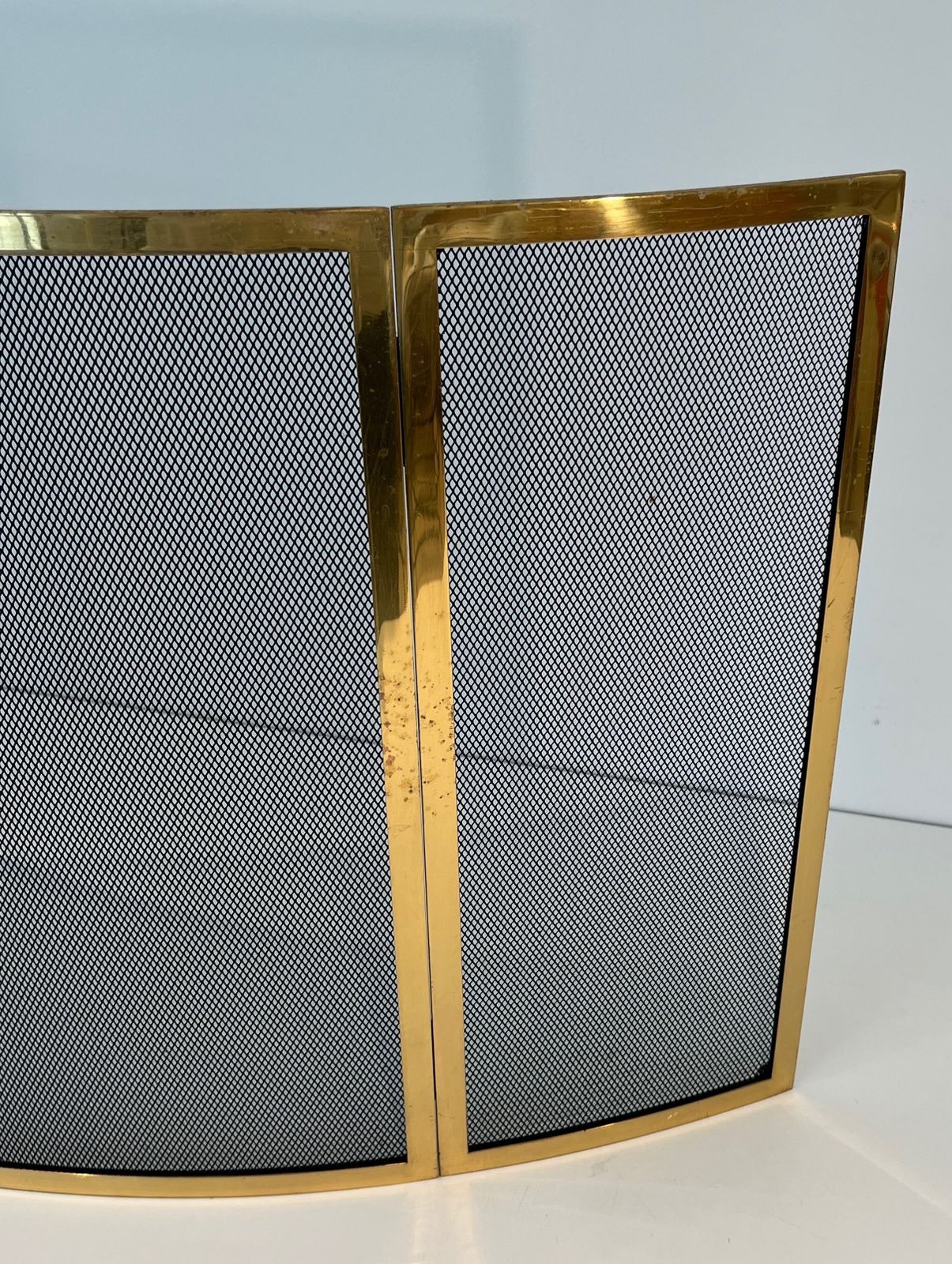 photo furniture Curved Brass Firewall And Wire Mesh