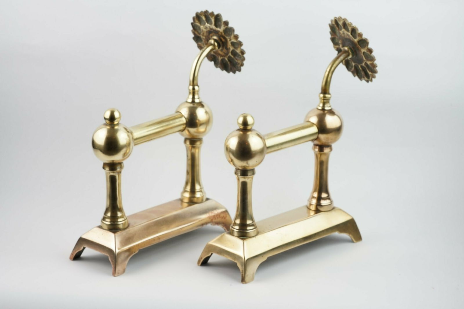 A Pair Of Aesthetic Movement Sunflower Brass Fire Dogs, Circa 1875 photo for sale
