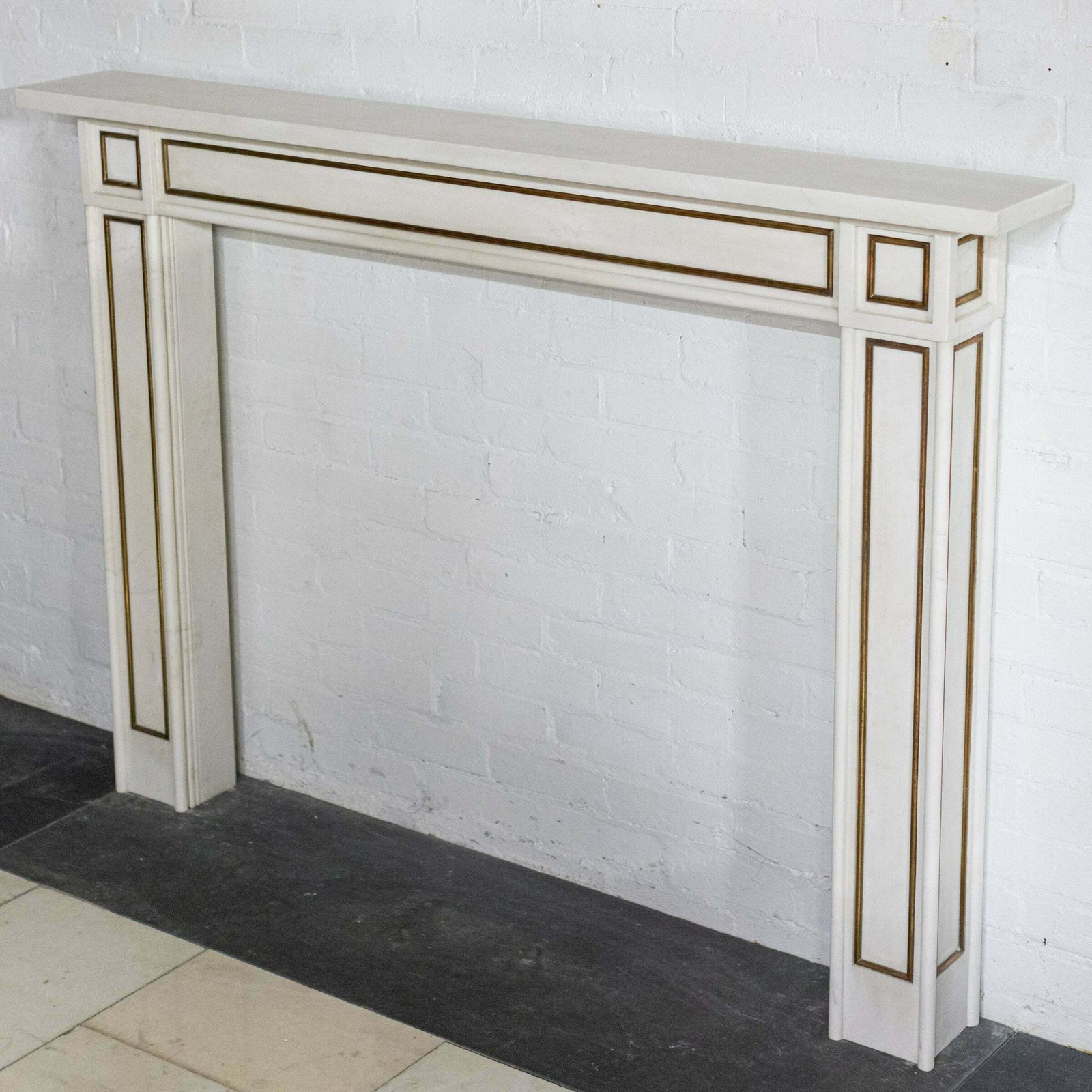 Reclaimed Statuary Marble Fireplace Surround With Brass Detail photo Home Fixtures
