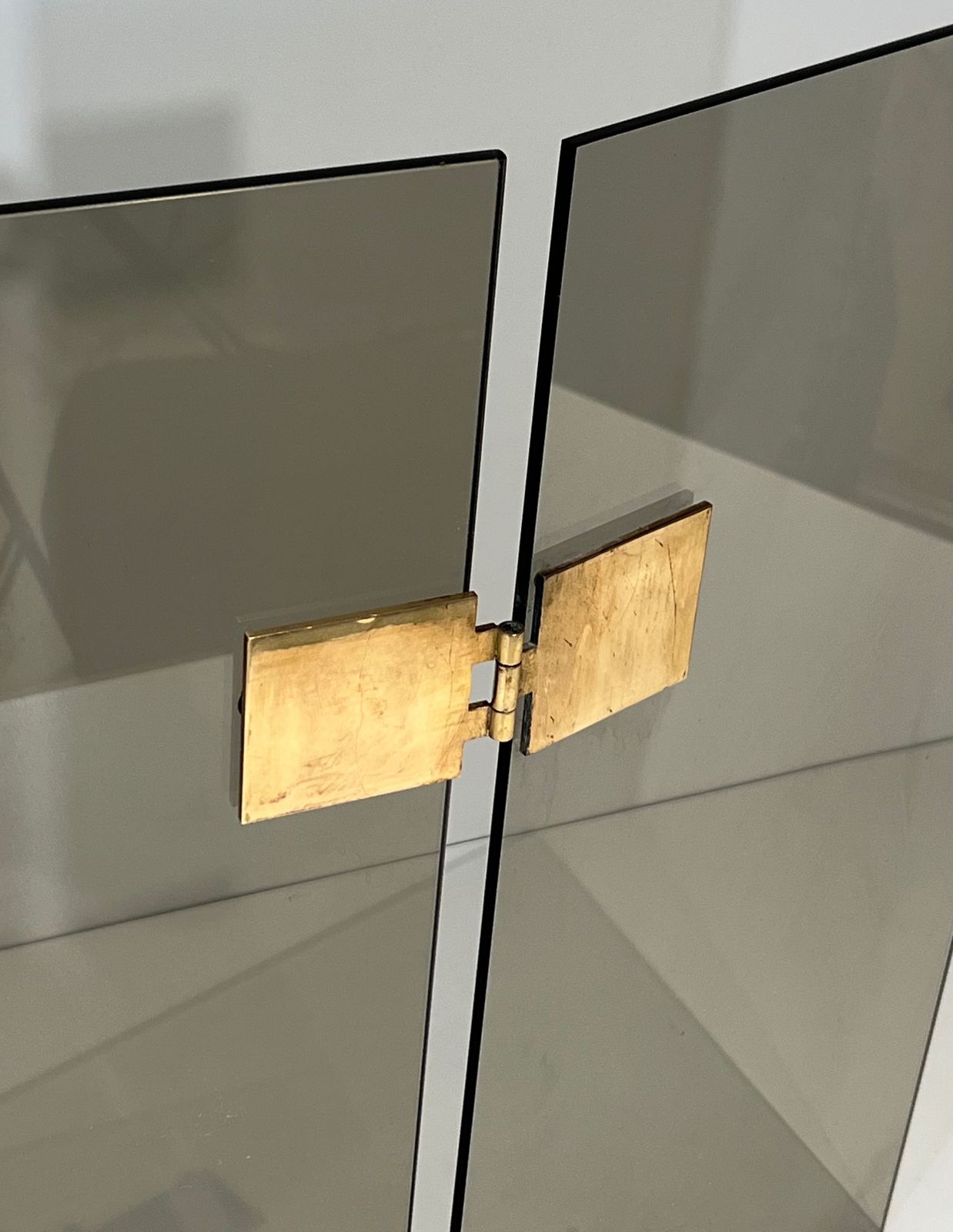 photo furniture Tri Fold Firewall In Smoked Glass And Brass. Around 1970
