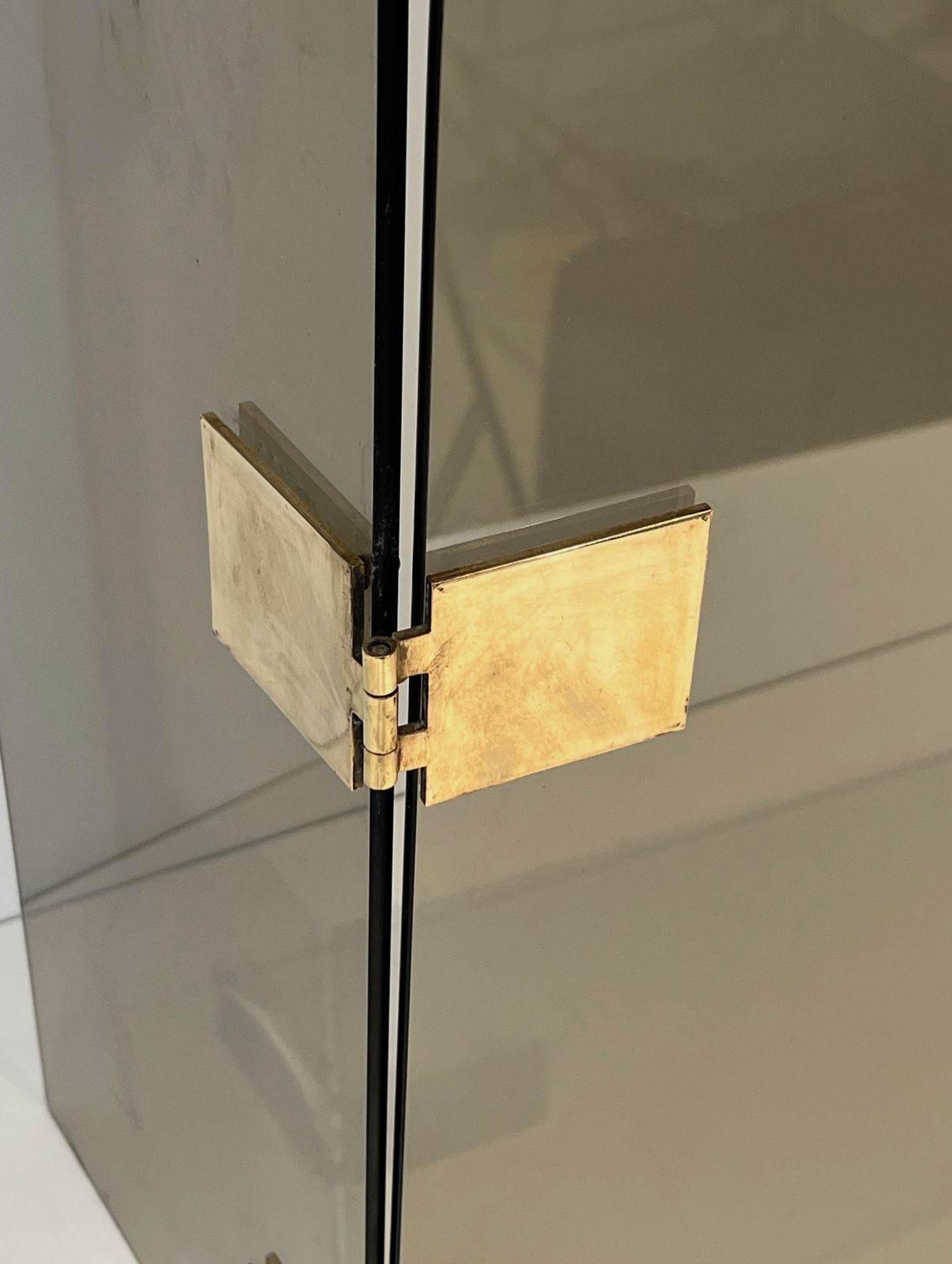 photo buy Tri Fold Firewall In Smoked Glass And Brass. Around 1970