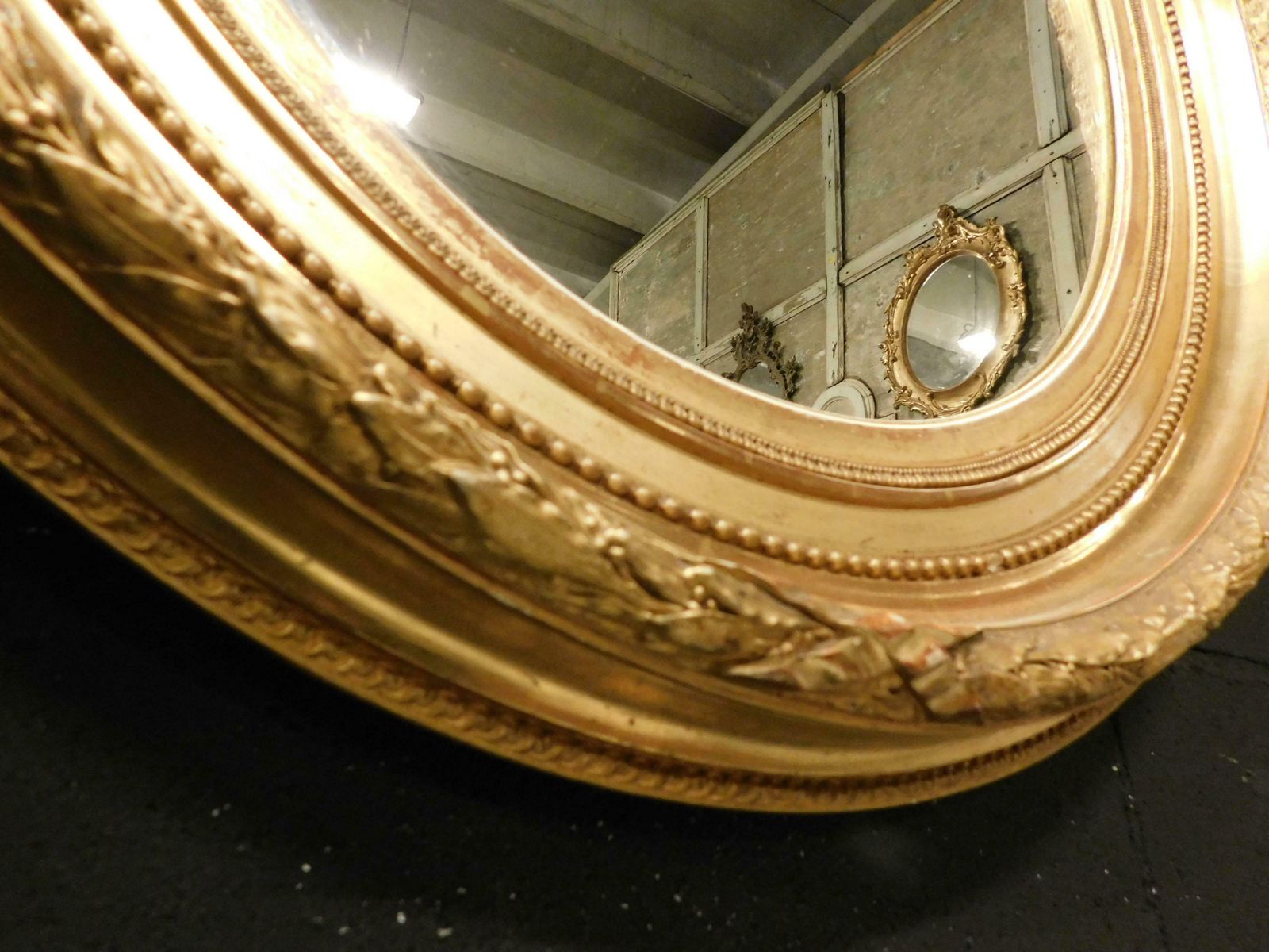 Old Oval Mirror In Gilded Wood Carved, Italy photo vintage