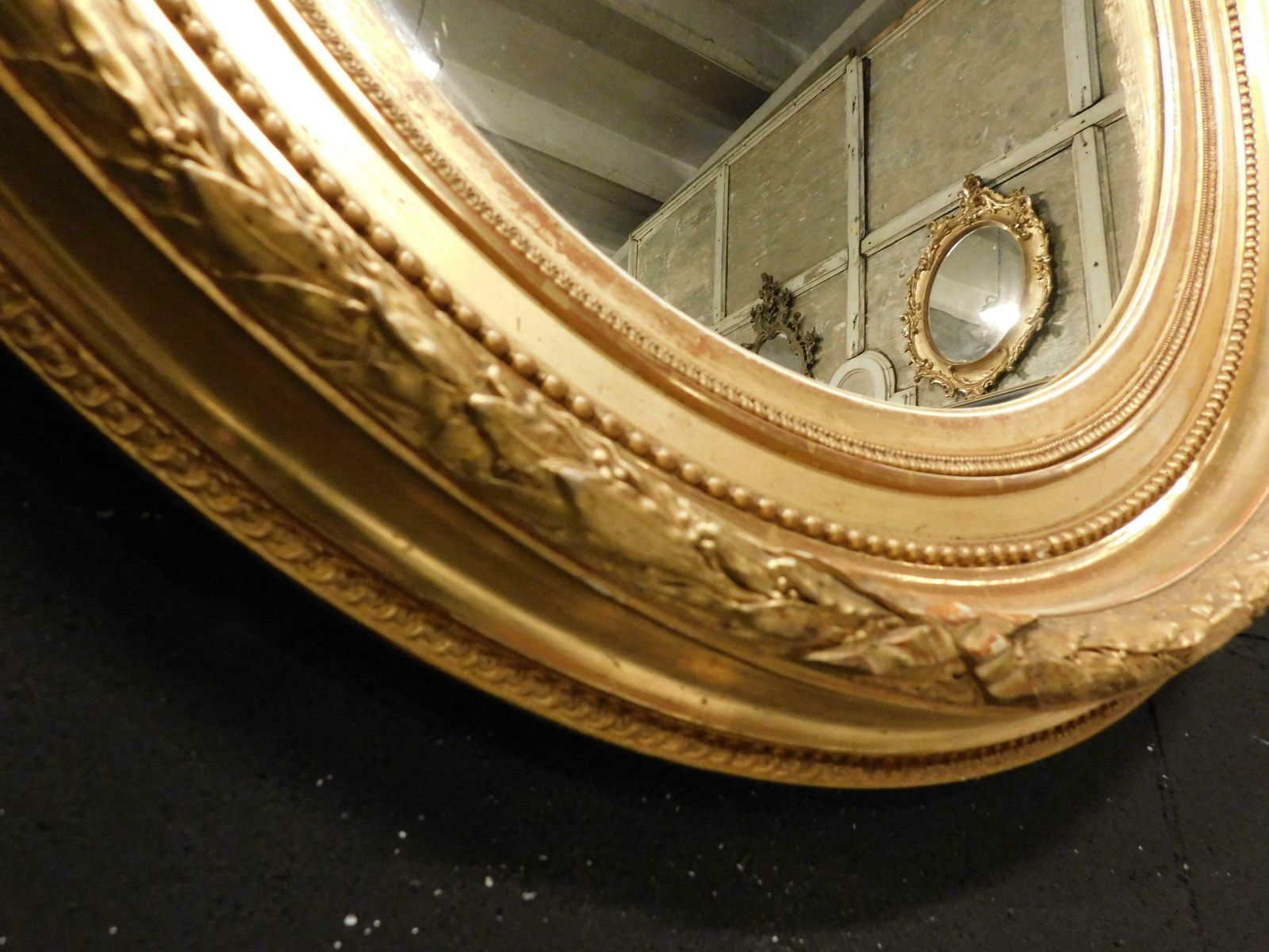 photo furniture Old Oval Mirror In Gilded Wood Carved, Italy