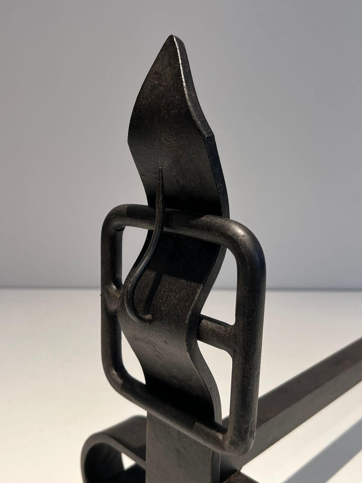 photo furniture Pair Of Modernist Andirons Representing A Belt