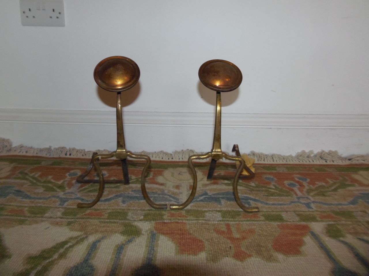 A Pair Of Arts And Crafts Brass Fire Dogs .