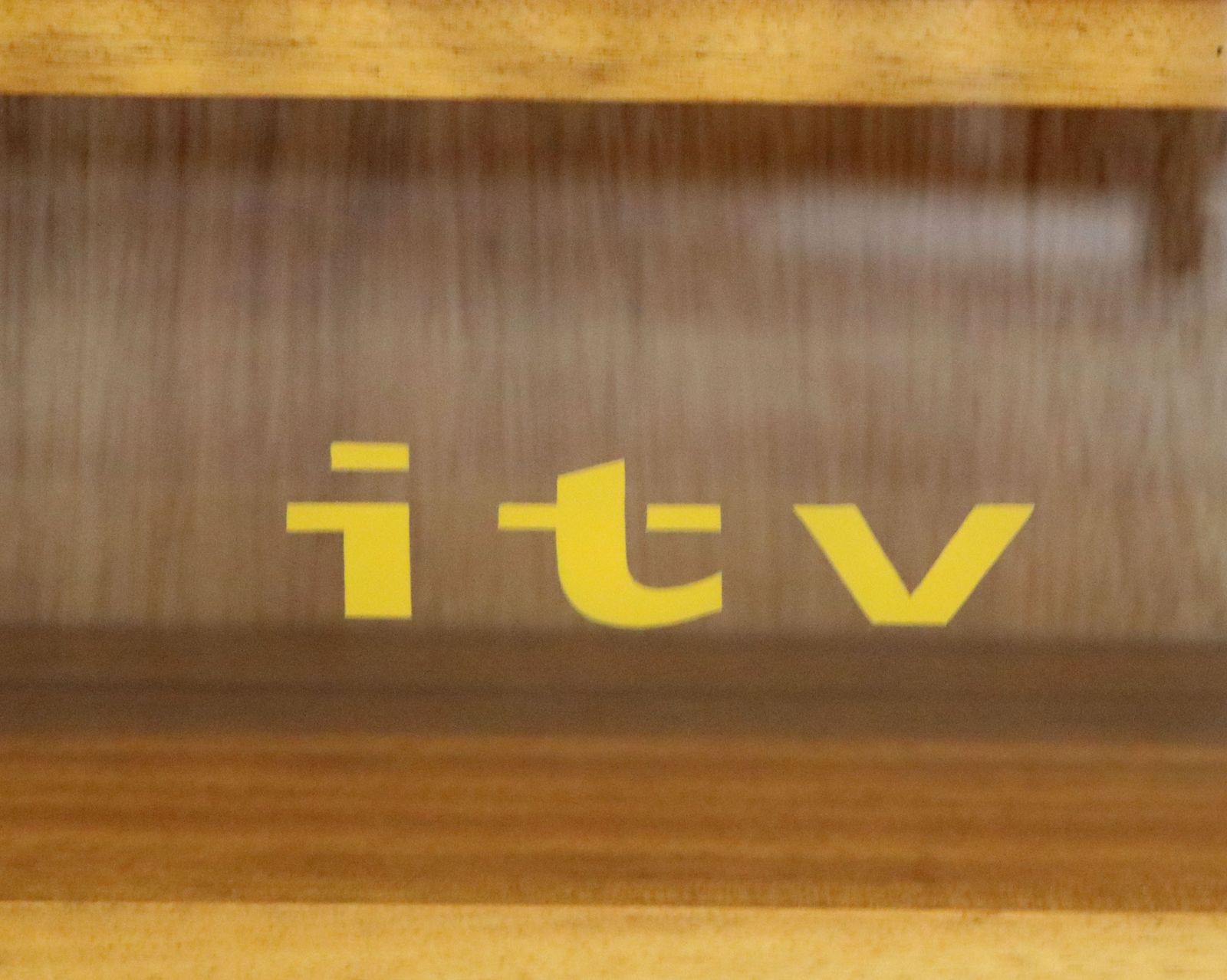 A Mid Century Gibbs Display Cabinet With The Anglia Television Logo. photo for sale