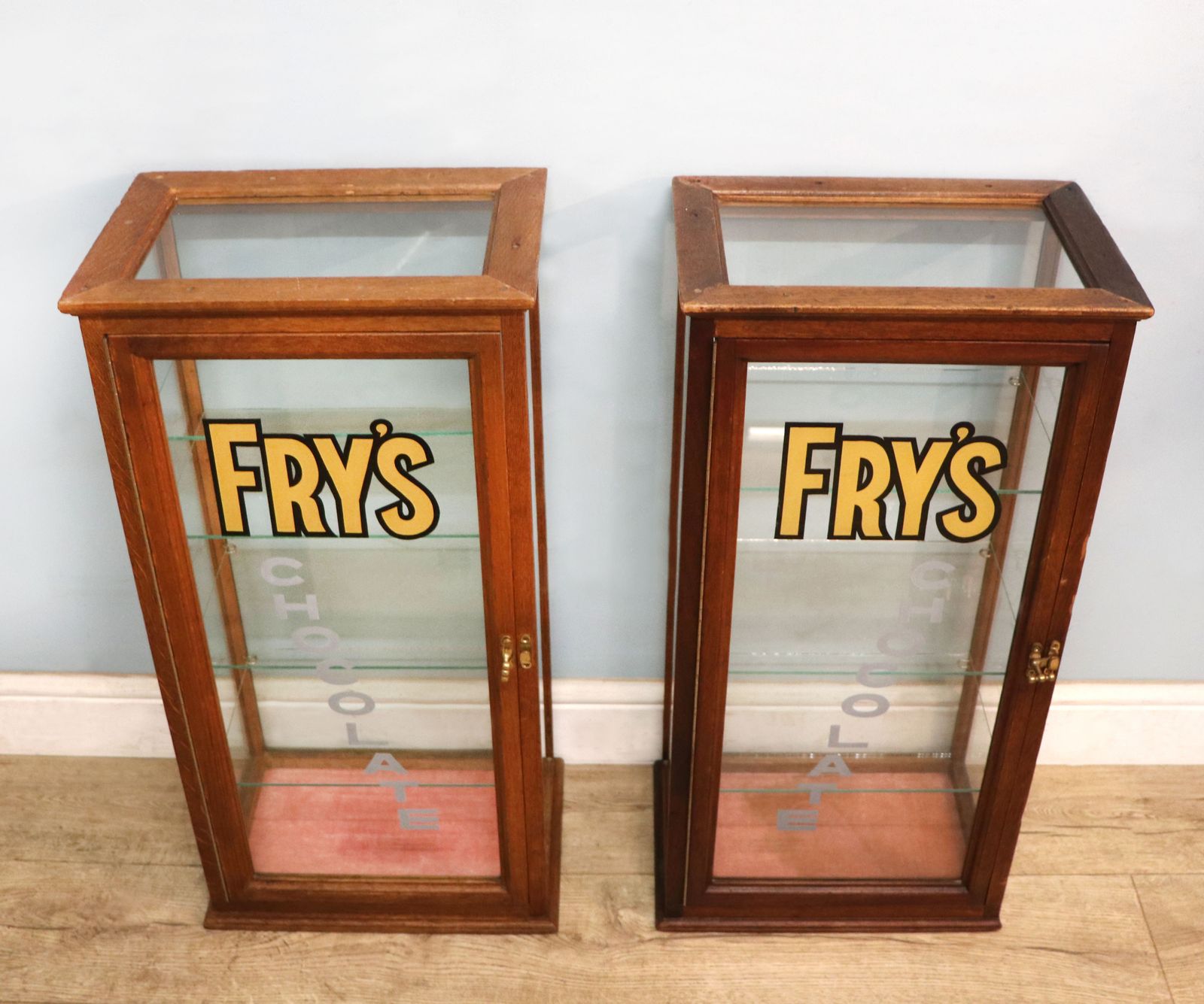 A Lovely Pair Of Early 20th Century Counter Display Cabinets Later Sign Written For Frys Chocolate. photo furniture