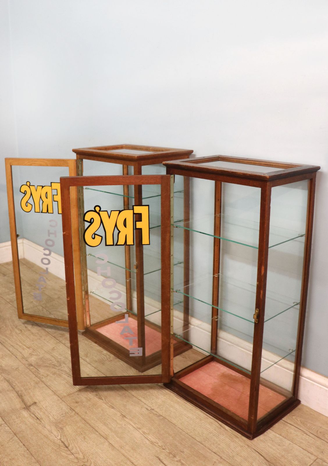 A Lovely Pair Of Early 20th Century Counter Display Cabinets Later Sign Written For Frys Chocolate. photo vinterior