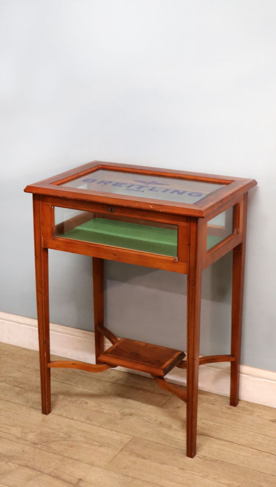 A Lovely Yew Wood Veneered Bijouterie Display Table, Later Sign Written For Breitling Watches. photo 495.0