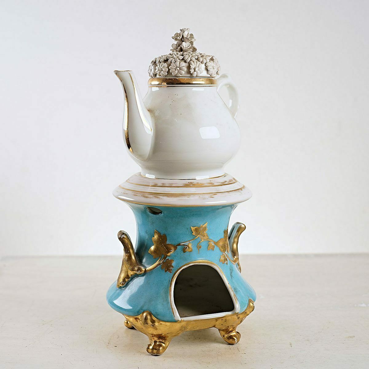 Antique Porcelain Teapot With Floral Decorations And Golden Details
