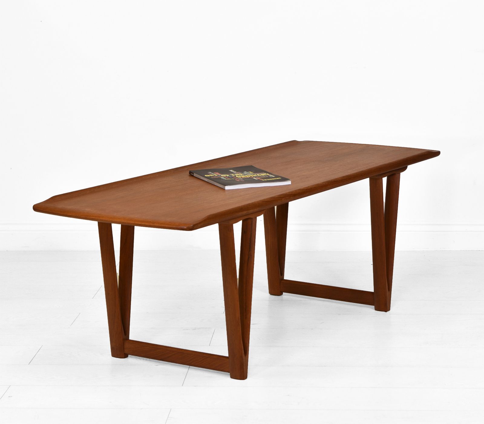 Mid Century Danish Teak Coffee Table On V Shape Supports And Lipped Top Edge photo Furniture