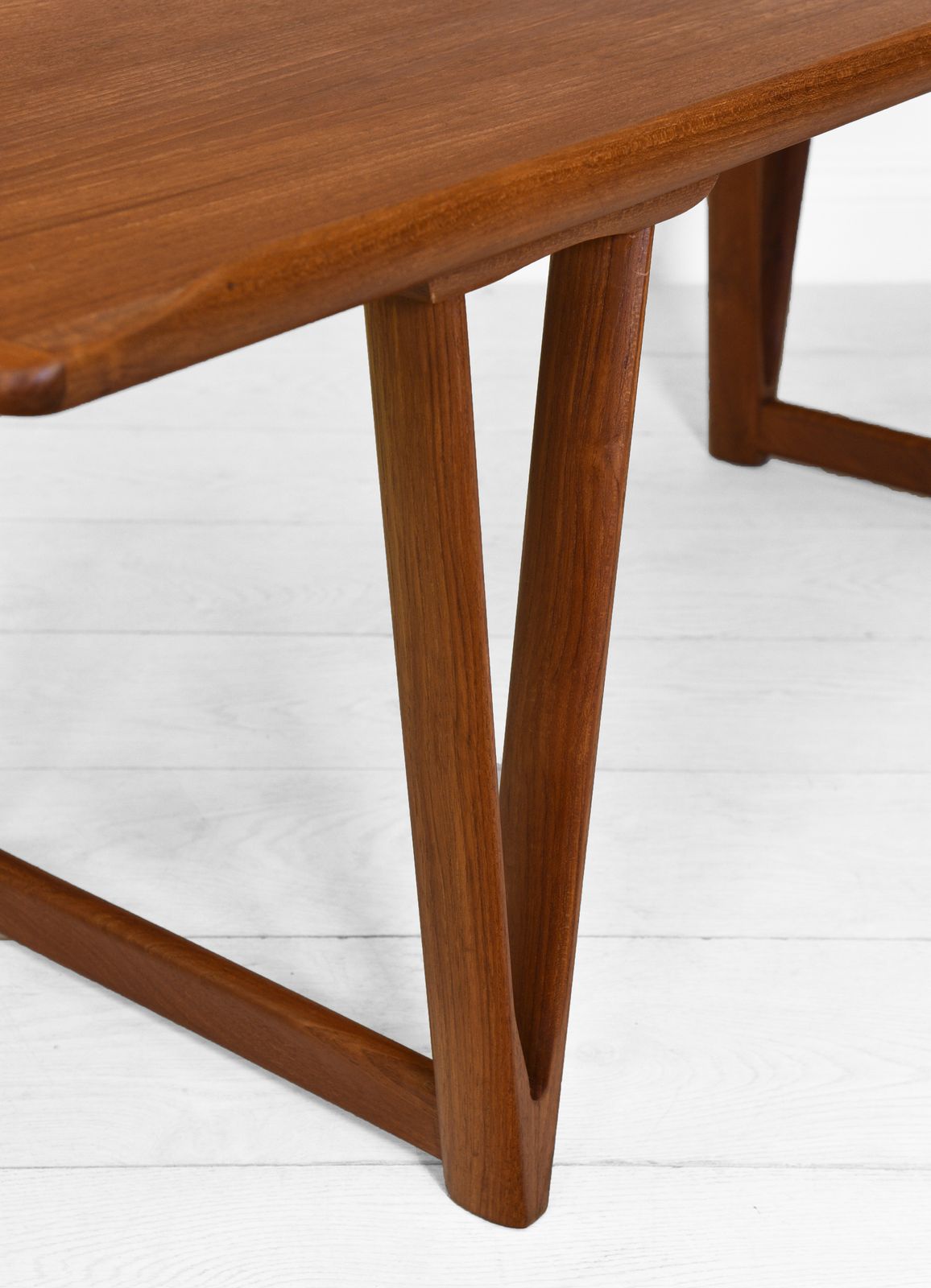 Mid Century Danish Teak Coffee Table On V Shape Supports And Lipped Top Edge photo 995.0