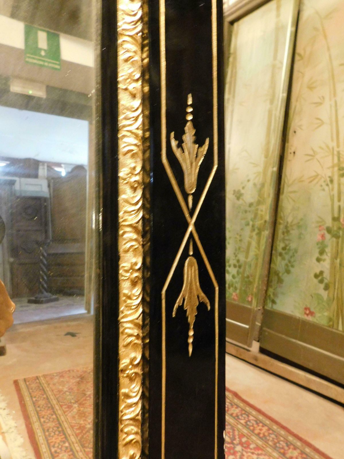 photo for sale Mirror In Black Lacquered Wood, With Rich Golden Sculptures, Italy
