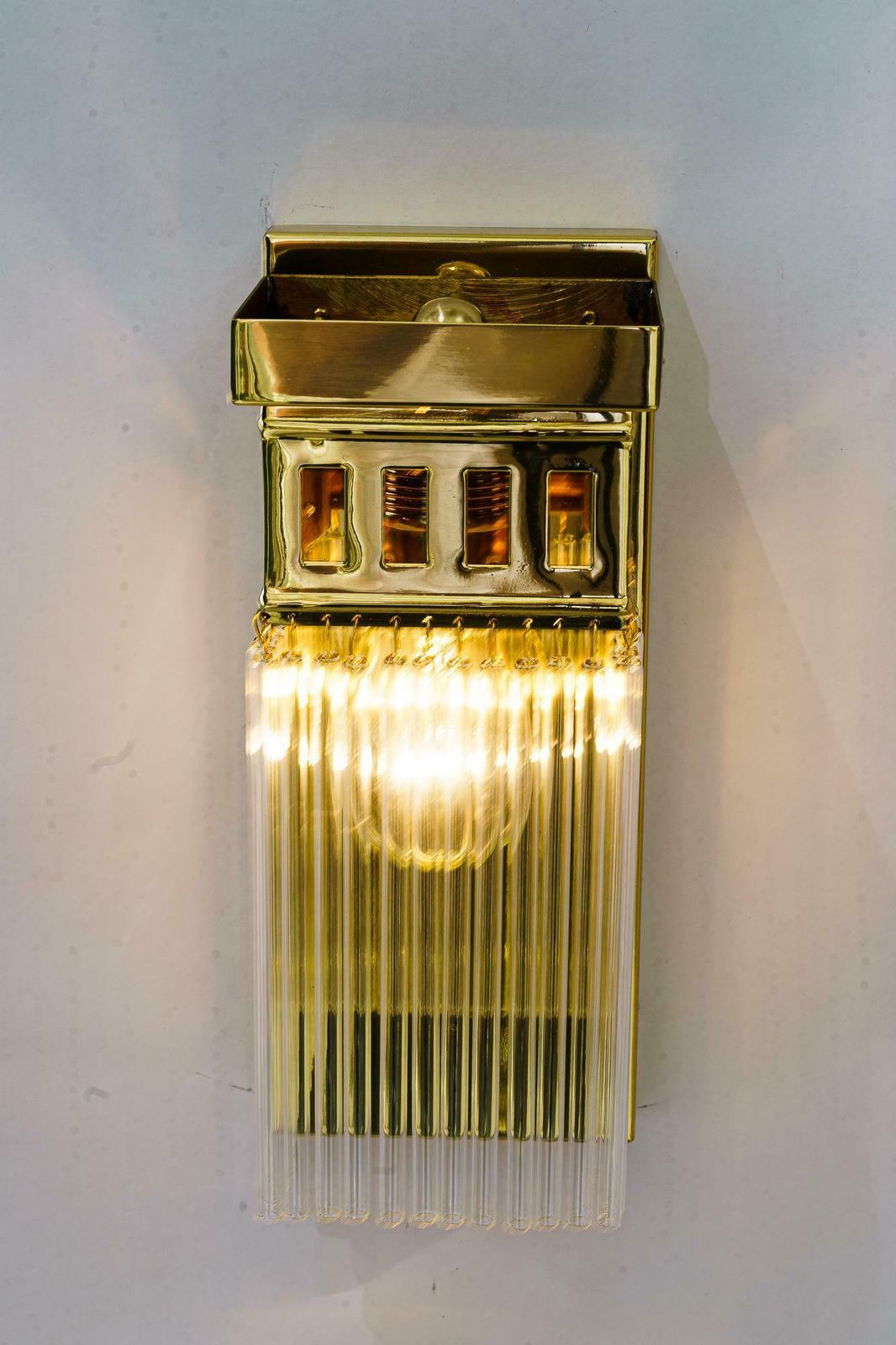 491.0 Reproduction Of A Art Deco Wall Lamp With Glass Sticks photo