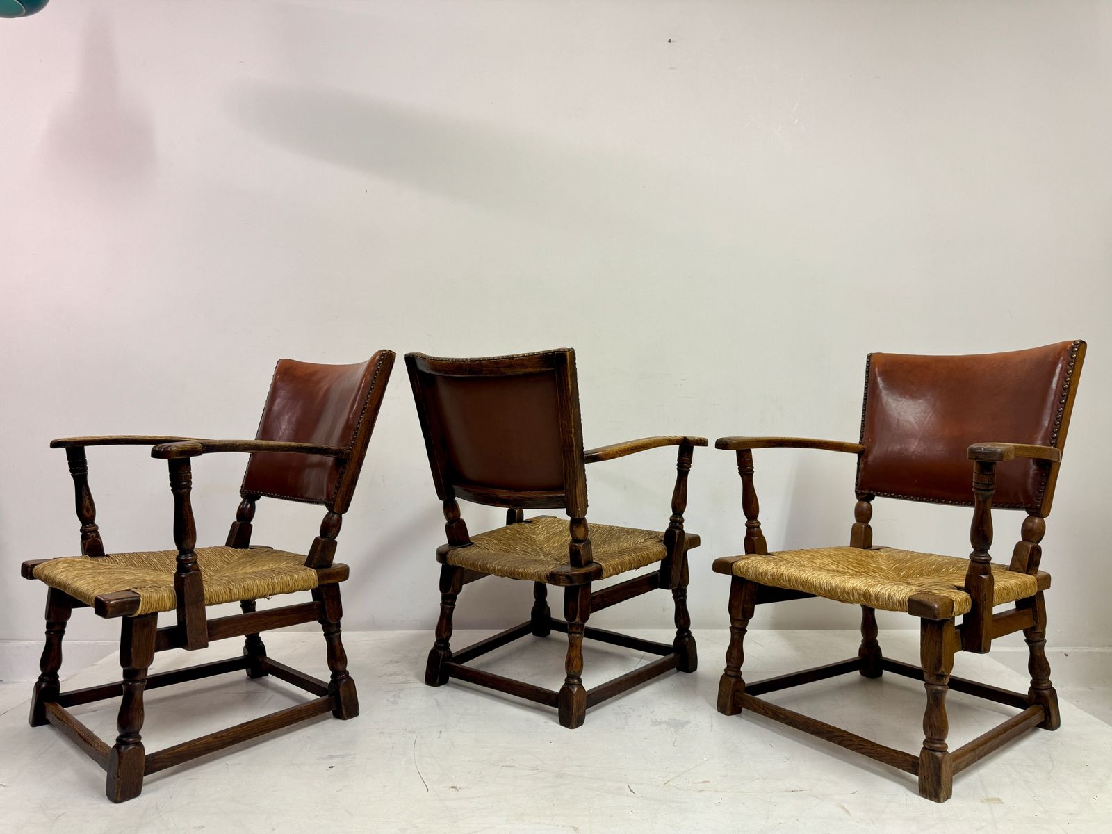 photo vintage Set Of Three Oak Armchairs With Rush And Leather Seats