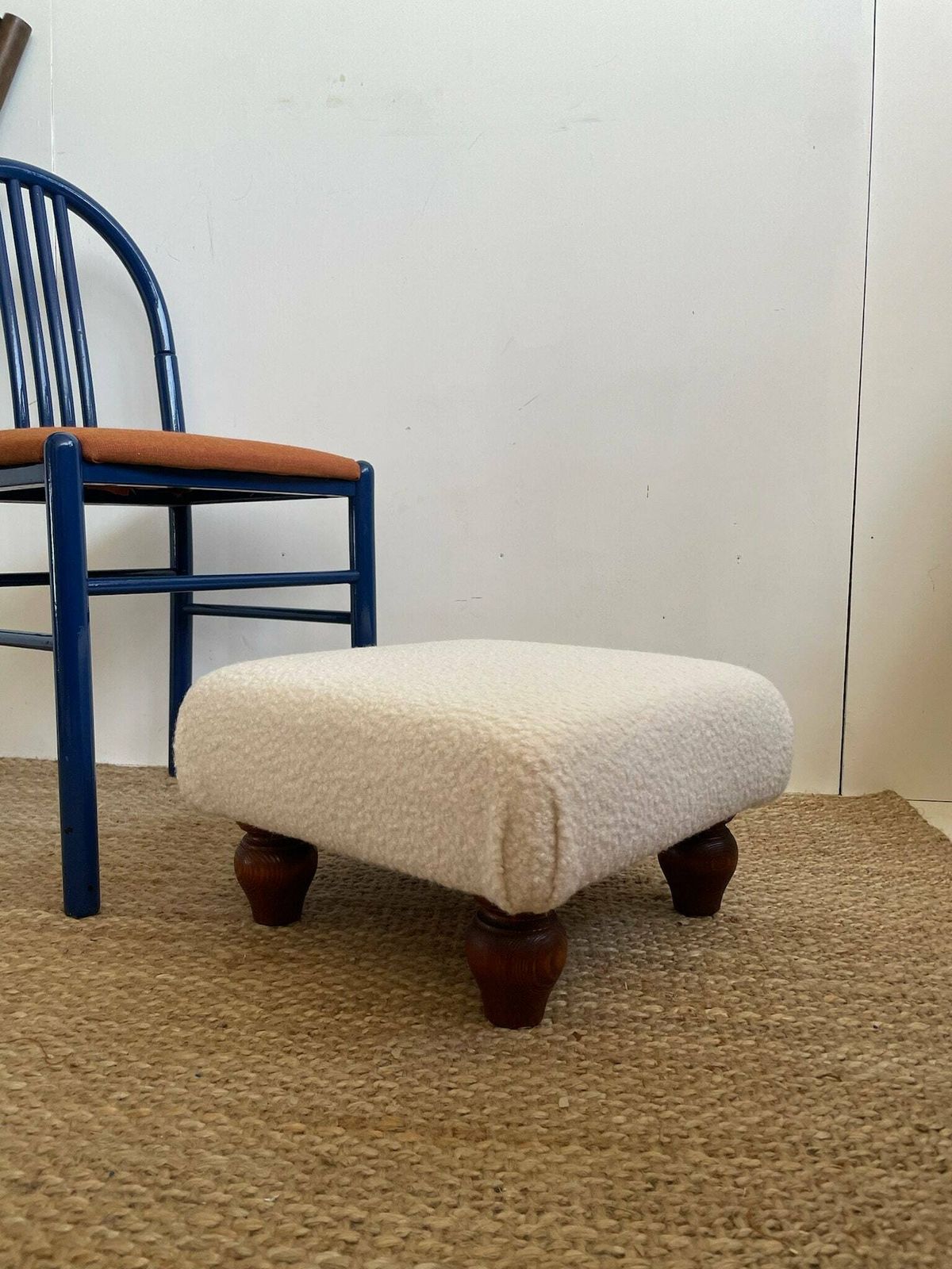 Chunky Low Lying Footstool With Tapered Legs And Cream Boucle Fabric photo for sale