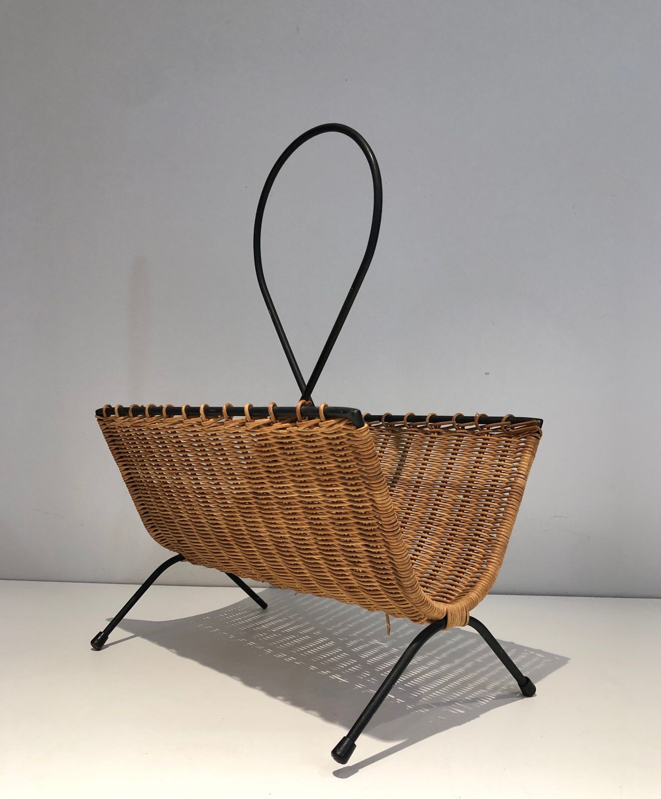 Rattan And Black Lacquered Metal Magazine Rack photo 480.0