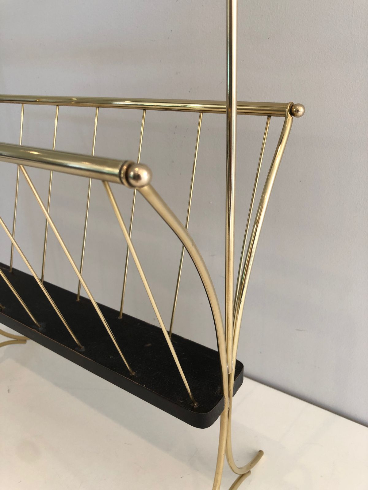 Magazine Rack In Blackened Wood And Brass photo vinterior
