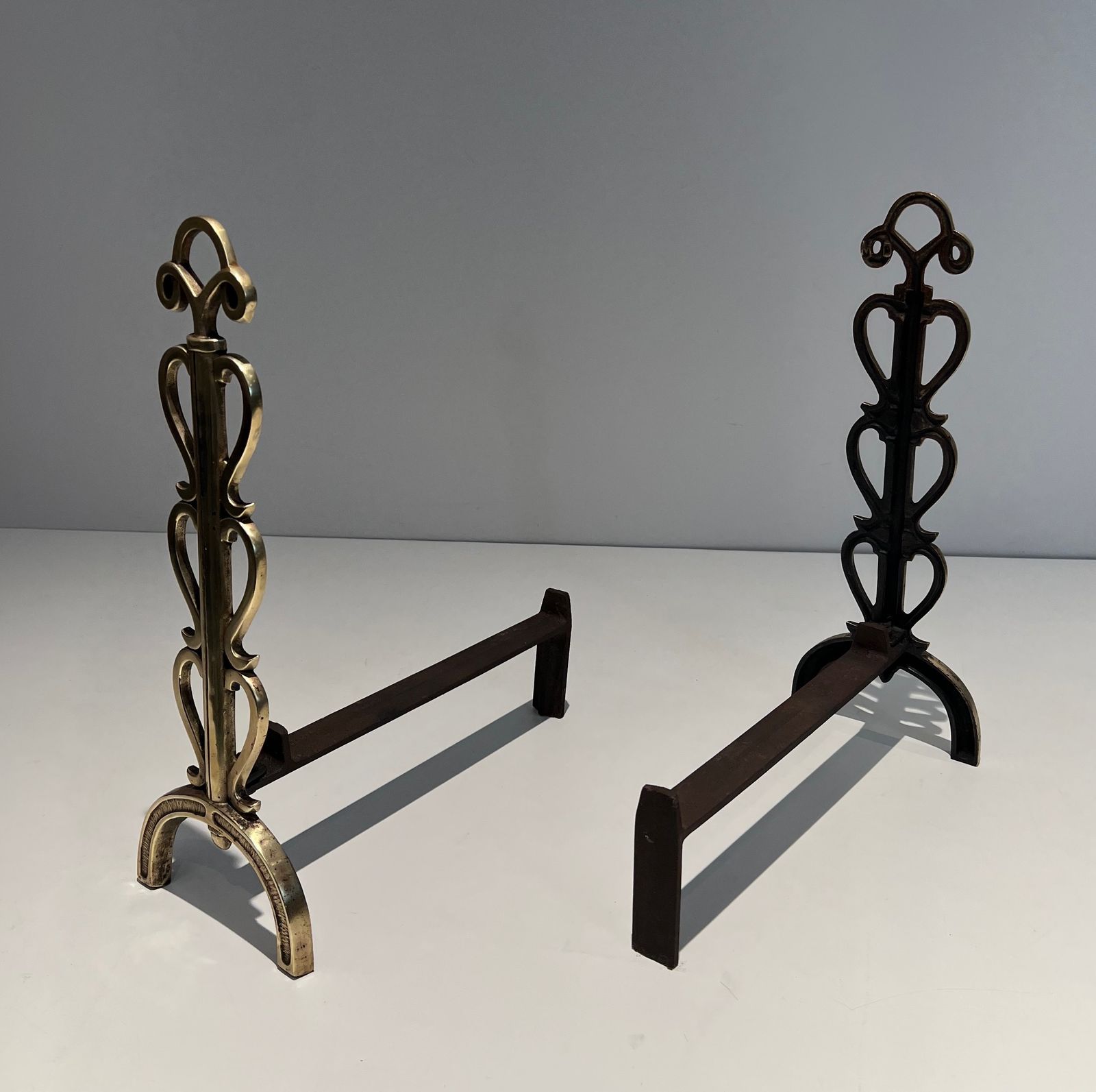 photo vintage Pair Of Andirons In Brass And Wrought Iron In The Style Of Raymond Subes