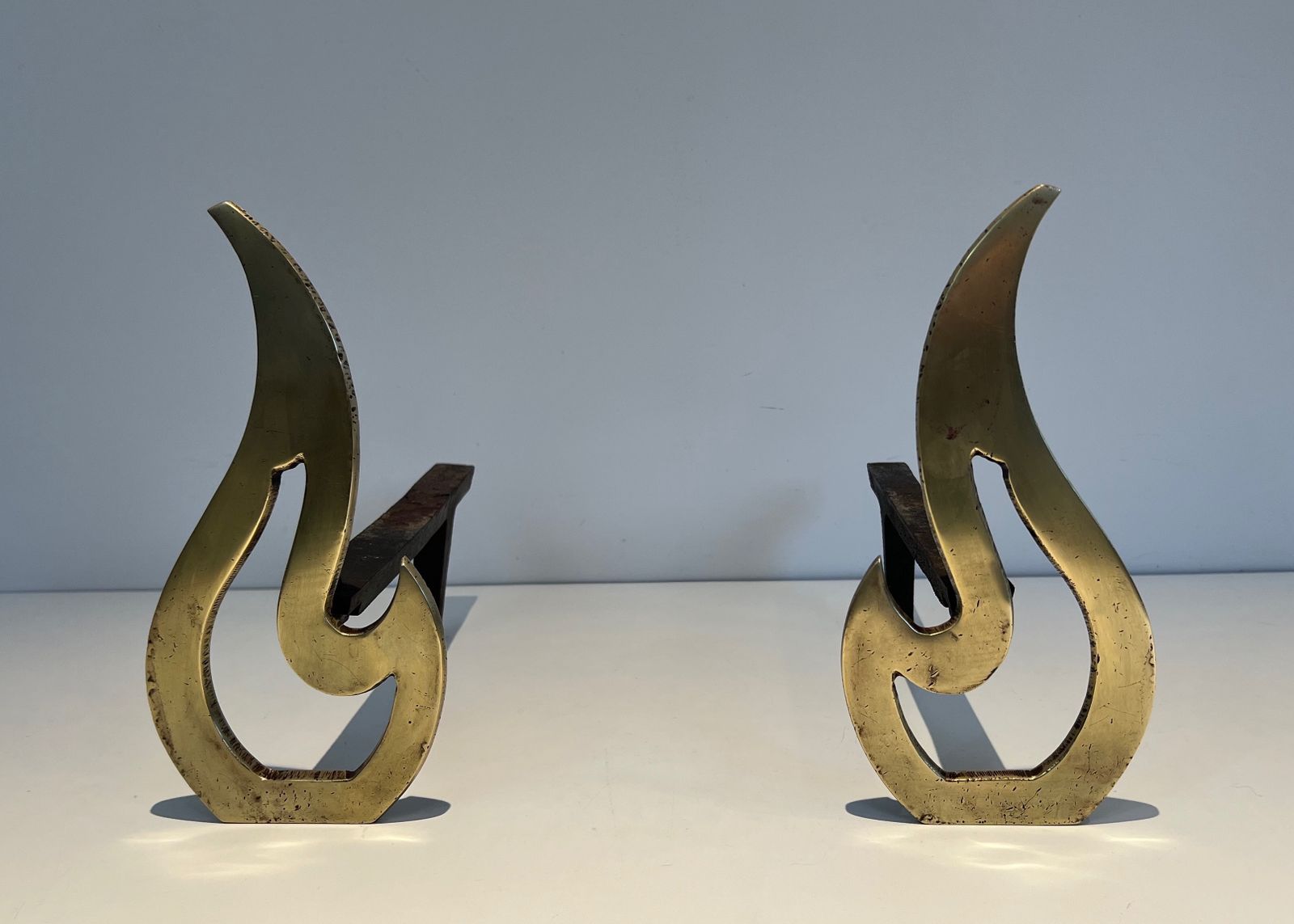 Pair Of Flame Andirons In Brass photo furniture