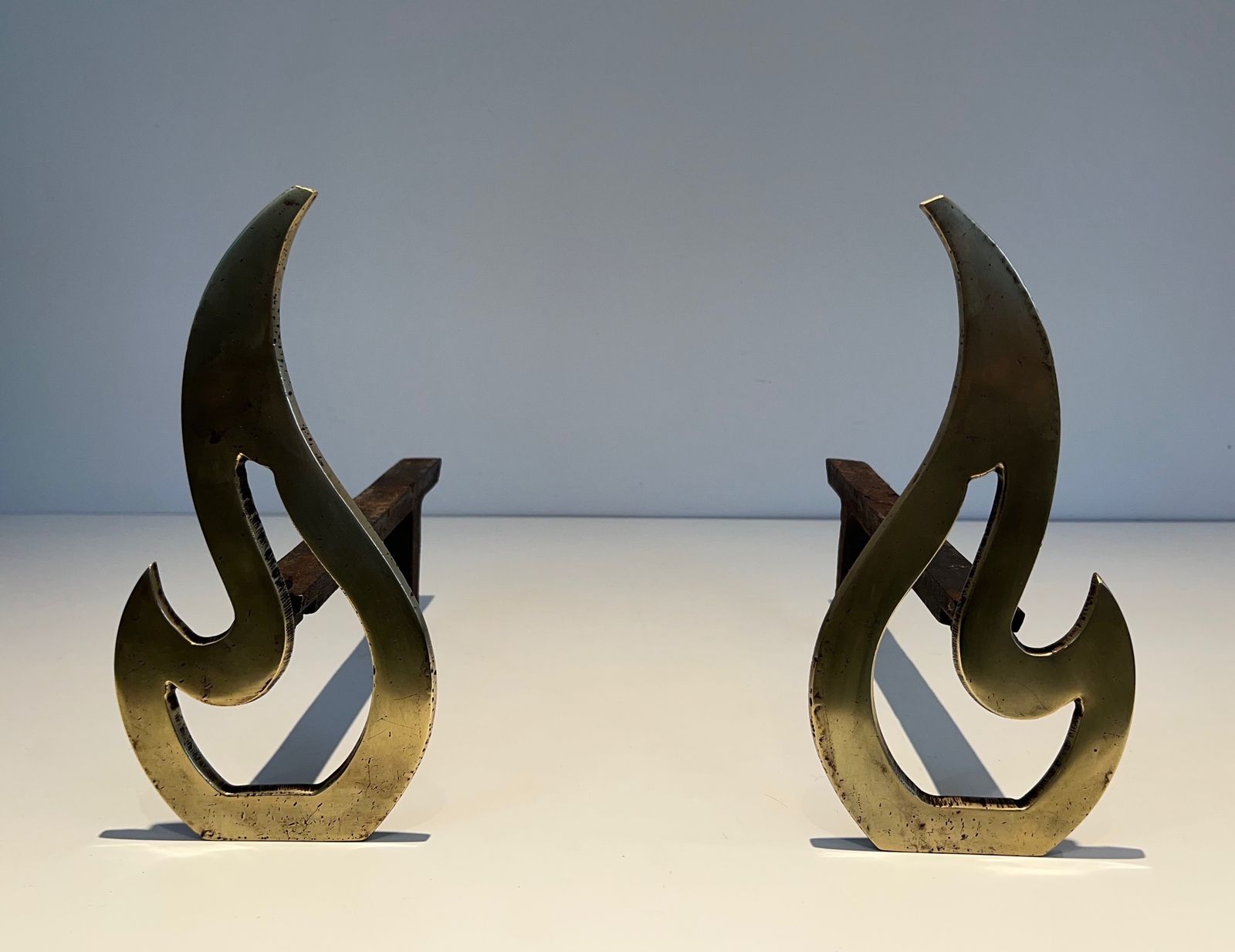 photo furniture Pair Of Flame Andirons In Brass