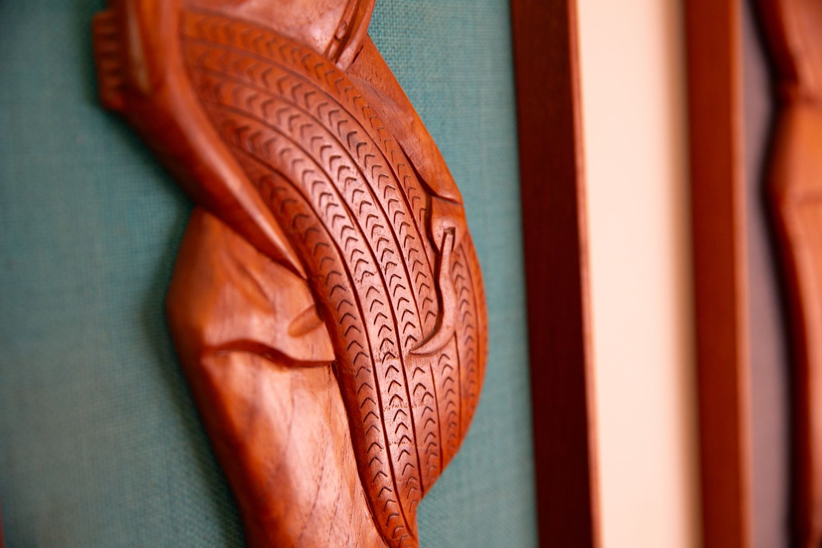 Pair Of Mid Century South East Asian Hardwood Wall Sculptures On Blue Canvas In Teak Frames photo for sale