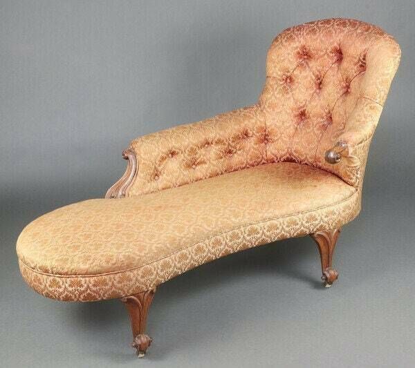 A Victorian Mahogany Show Frame Chaise Longue With Raised Back, Upholstered In Buttoned Floral Material