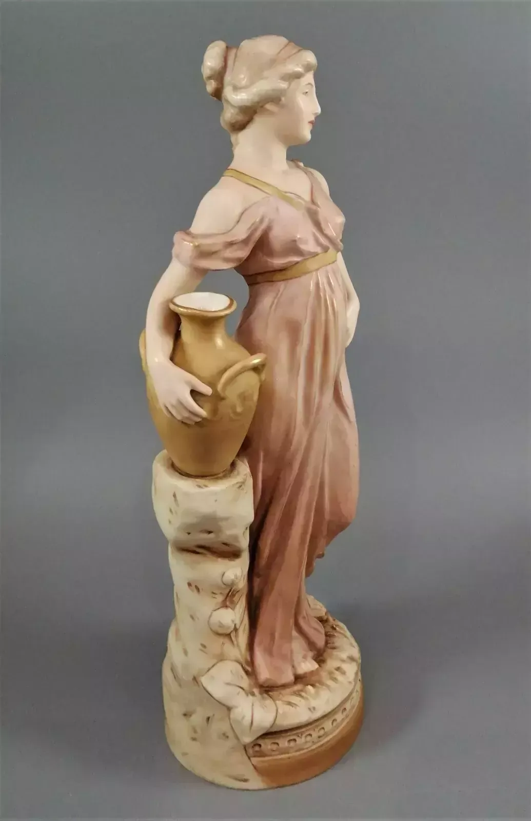Beautiful Antique Royal Dux Porcelain Figurine Depicting A Lady Holding A Jug. photo vinterior