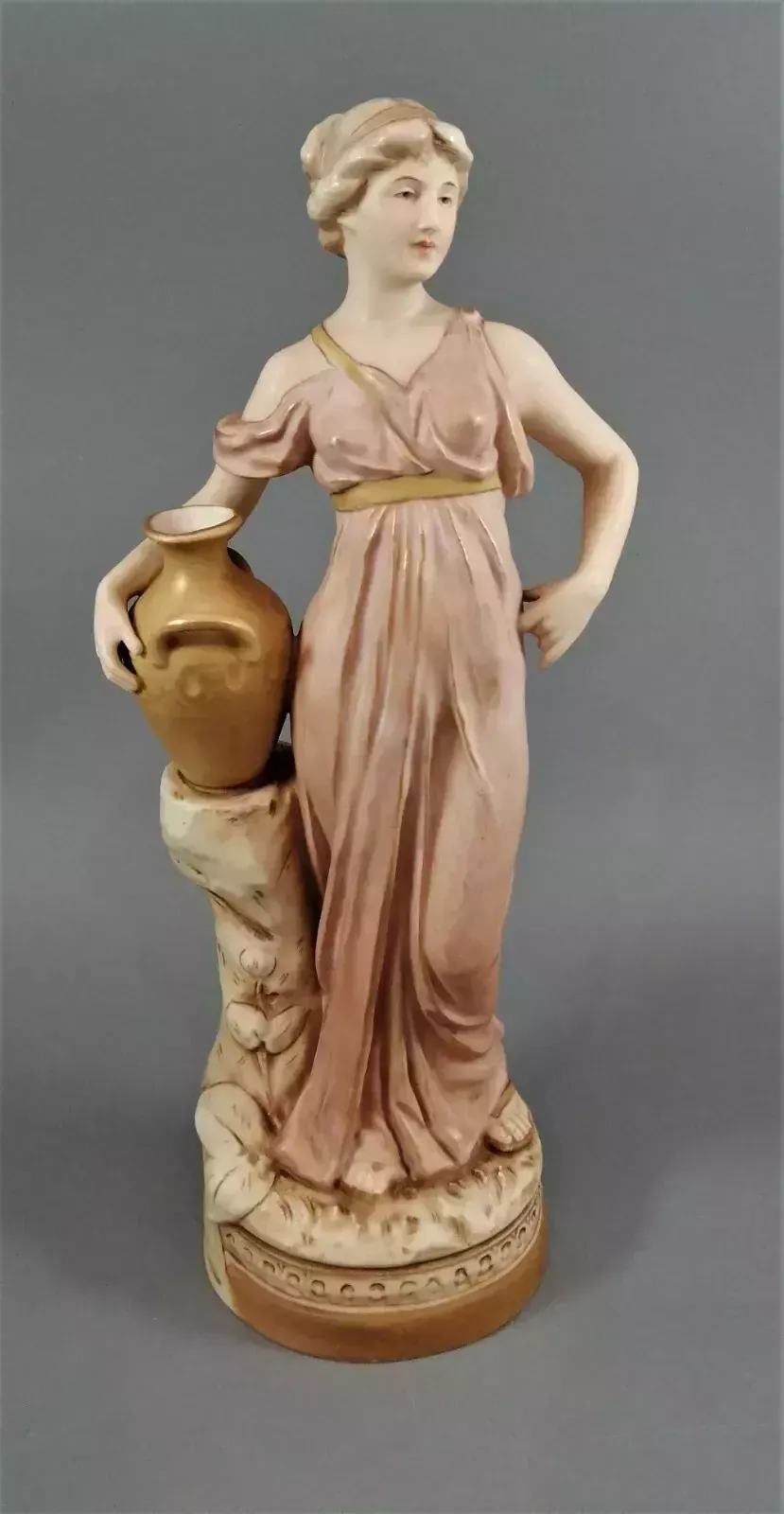 Beautiful Antique Royal Dux Porcelain Figurine Depicting A Lady Holding A Jug. photo vintage