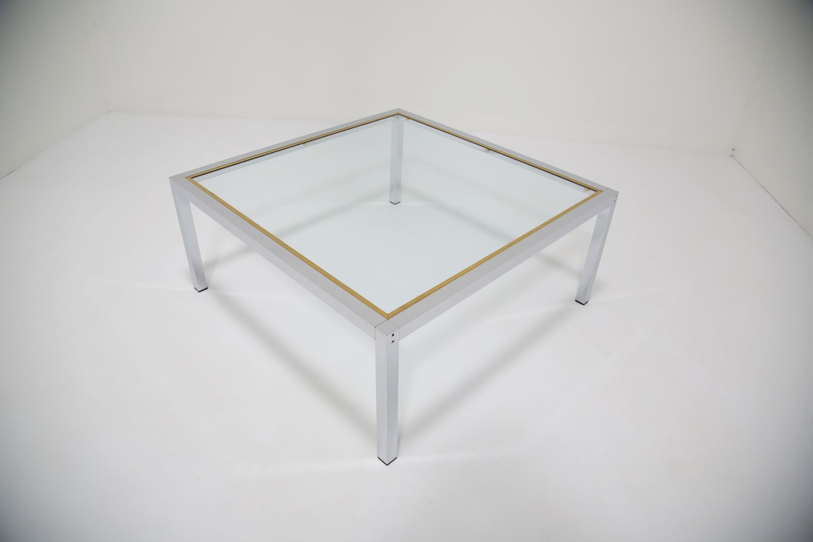 photo furniture Mid Century Chrome And Glass Coffee Table, Italy, 1970s.