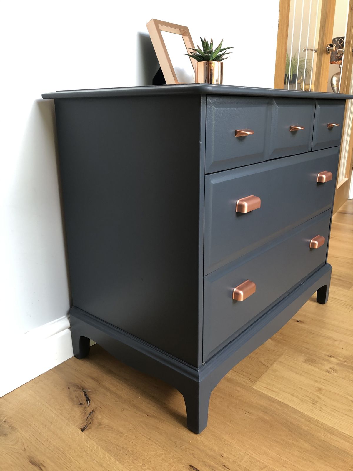 495.0 Stag Chest Of Drawers Painted In Blue With Copper Cup Handles photo