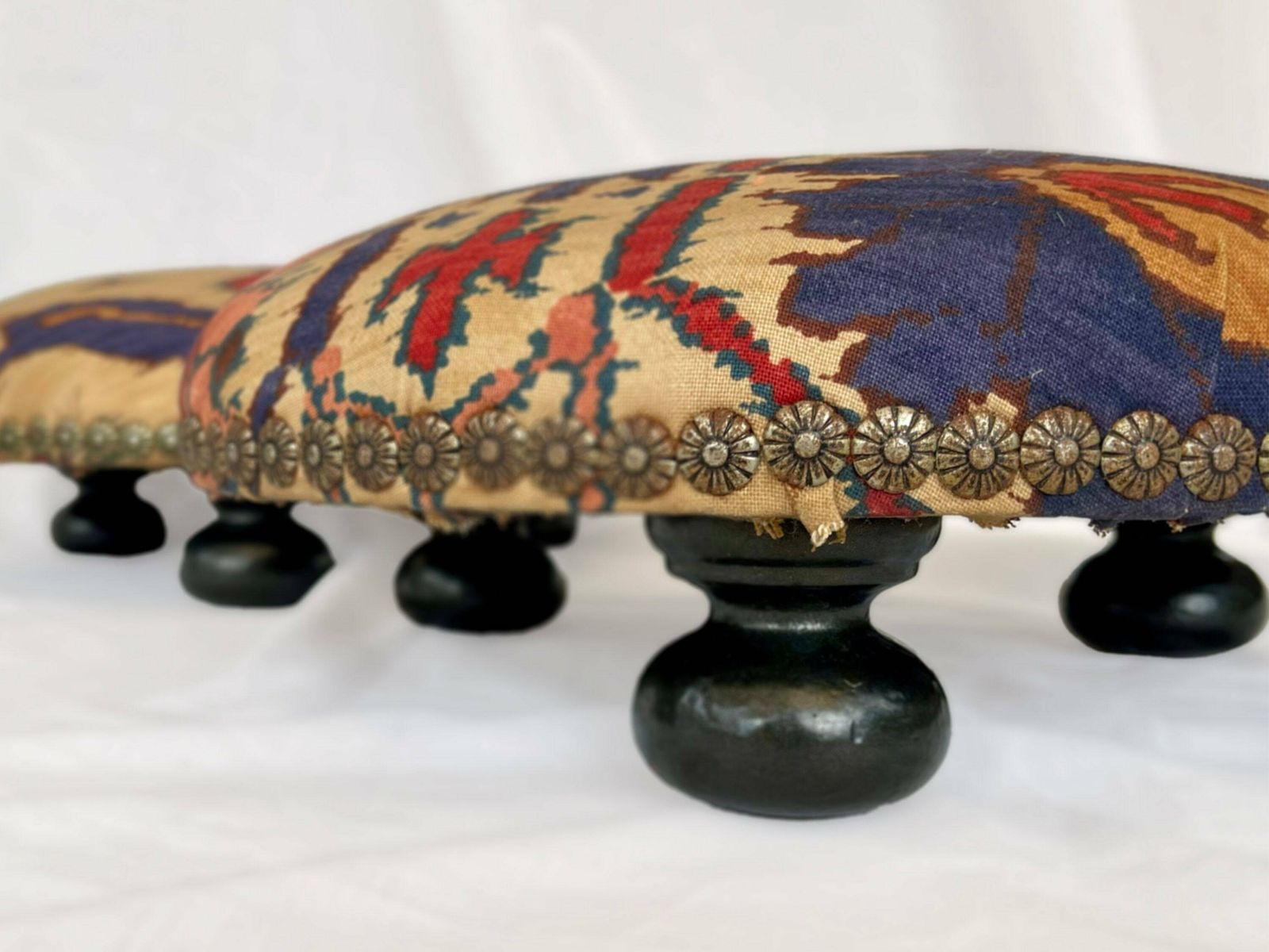 Antique French Style Foot Stools In Original Fabric With Floral Brass Flower Stud Detailing And Three Wooden Bun Feet To Base. photo furniture