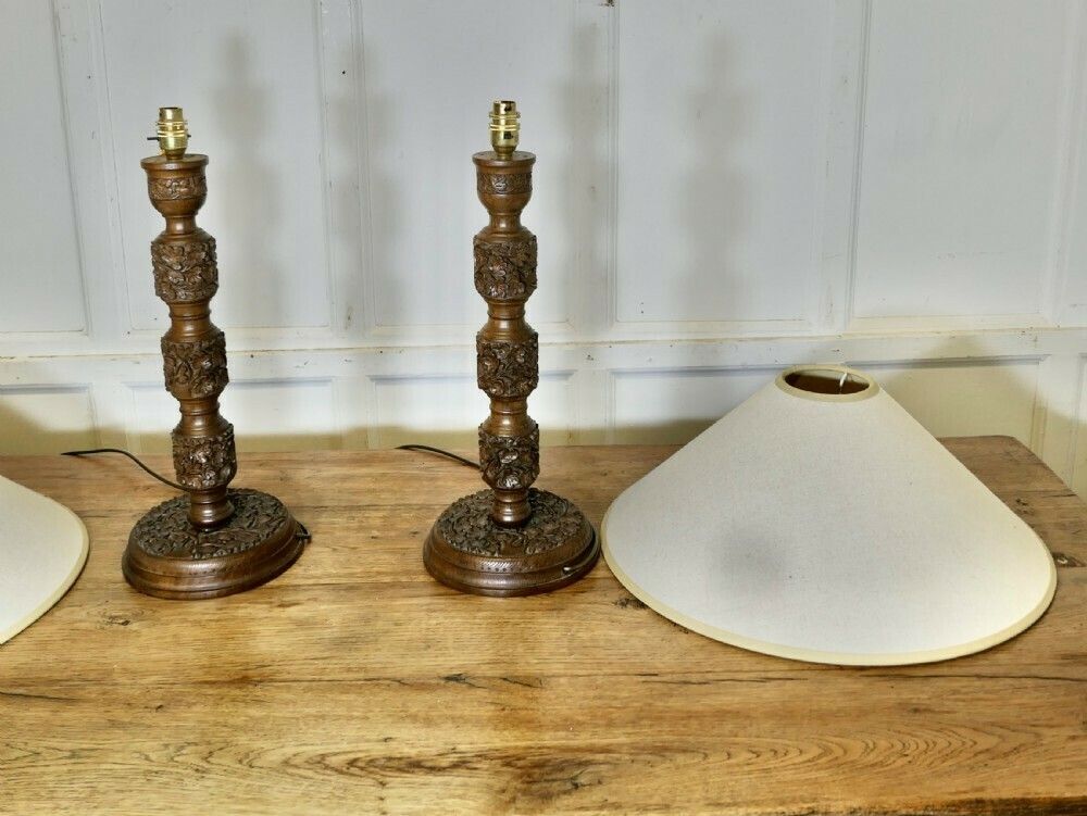 photo furniture A Pair Of Teak Carved Tree Of Life Table Lamps