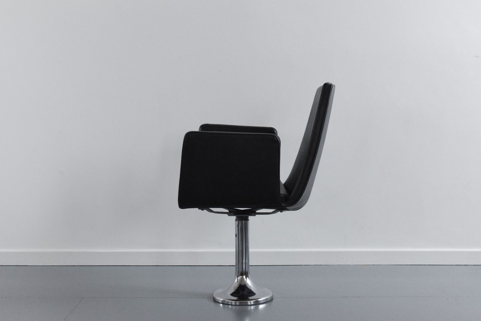 295.0 Vintage Single Black / Charcoal Grey Vinyl Fixed Swivel Arm Chair From Carlisle's Civic Centre Council Chamber photo