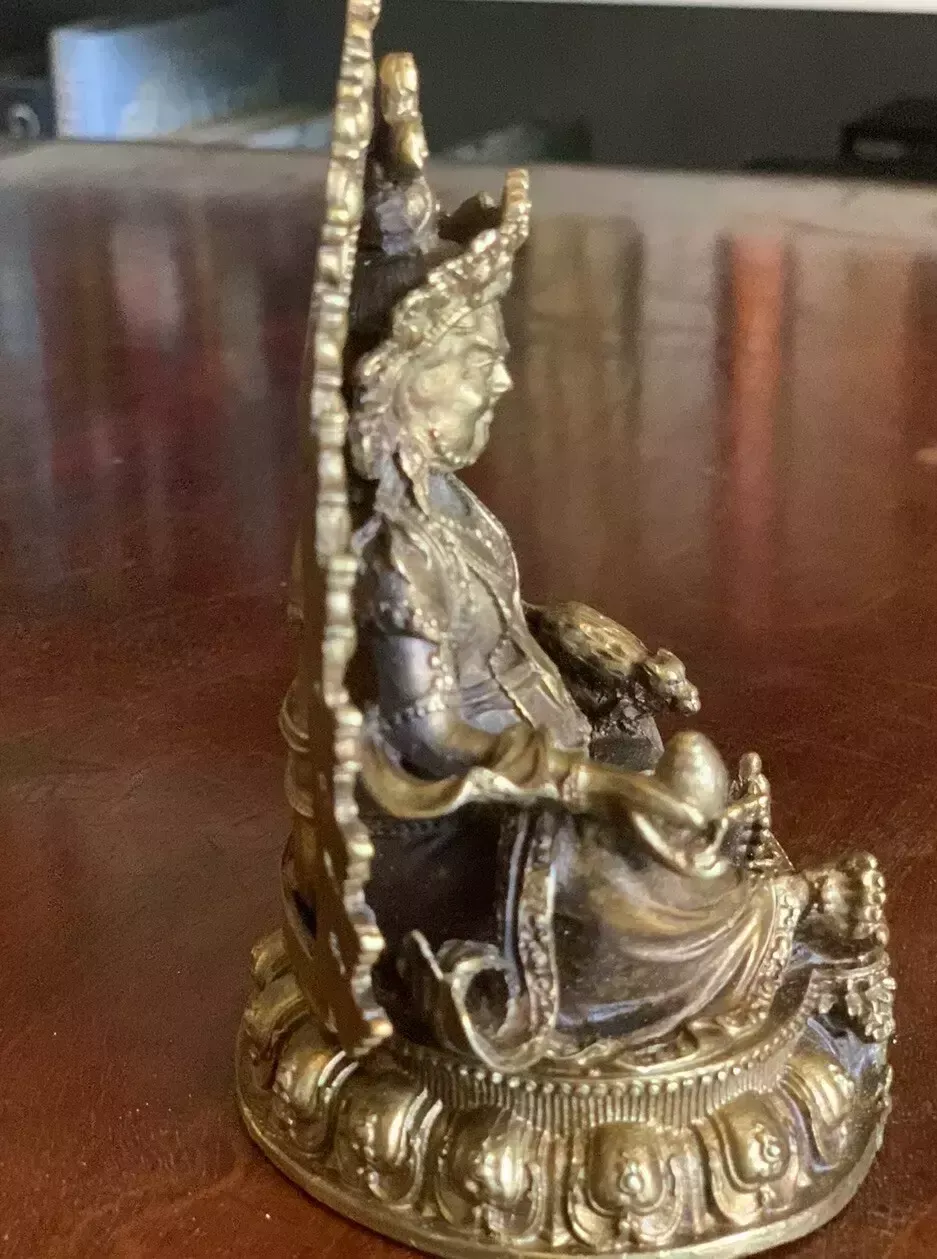 A Small Gilded Metal Statue Of The Tibetan Bodhisattva Kubera The God Of Wealth. photo furniture