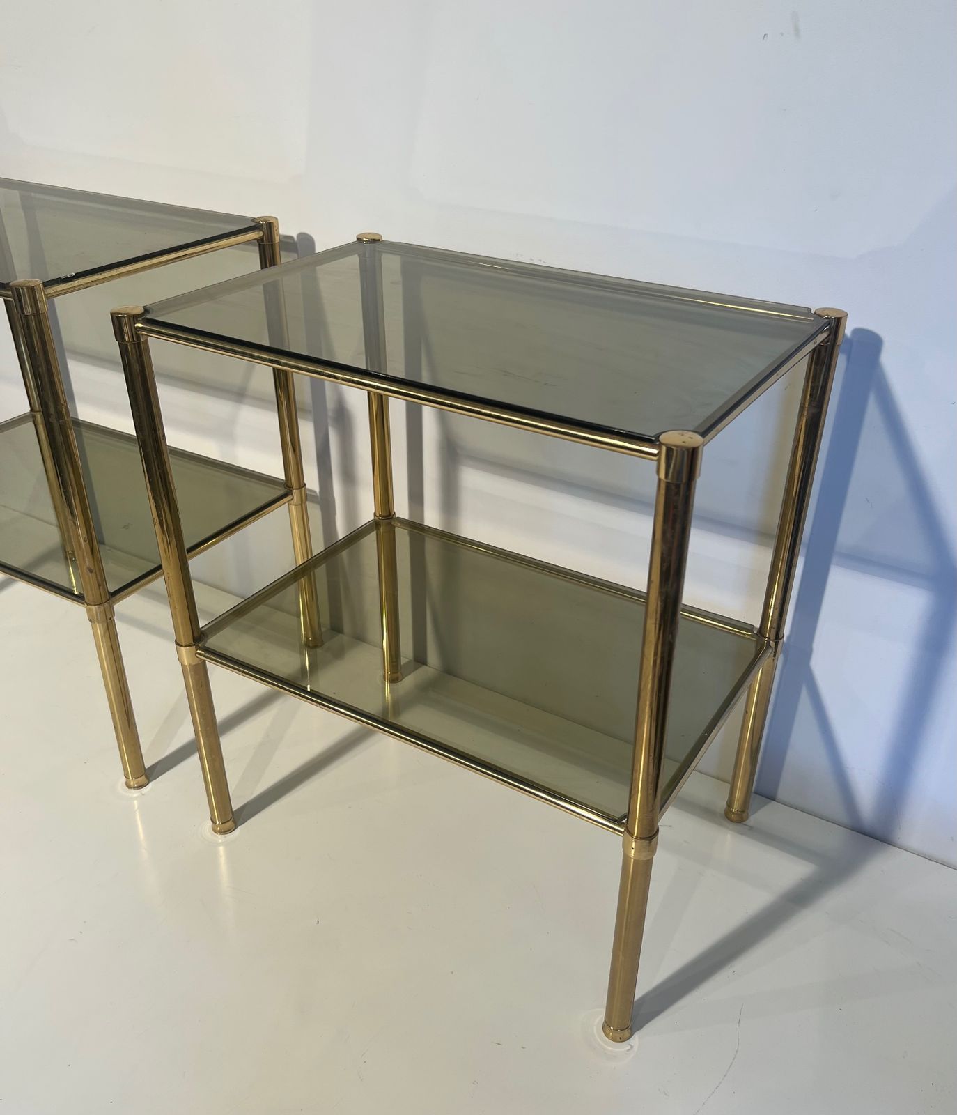 Pair Of Brass End Tables With Smoked Glass Trays. Circa 1970 photo for sale