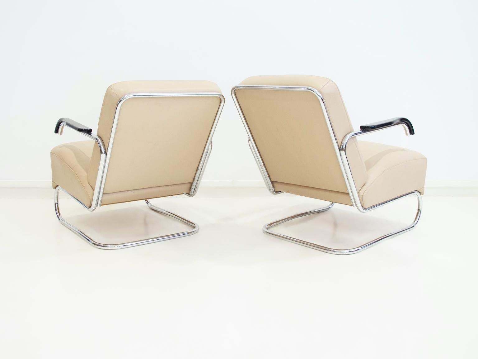 photo buy Pair Of Beige Leather And Tubular Steel Lounge Chairs