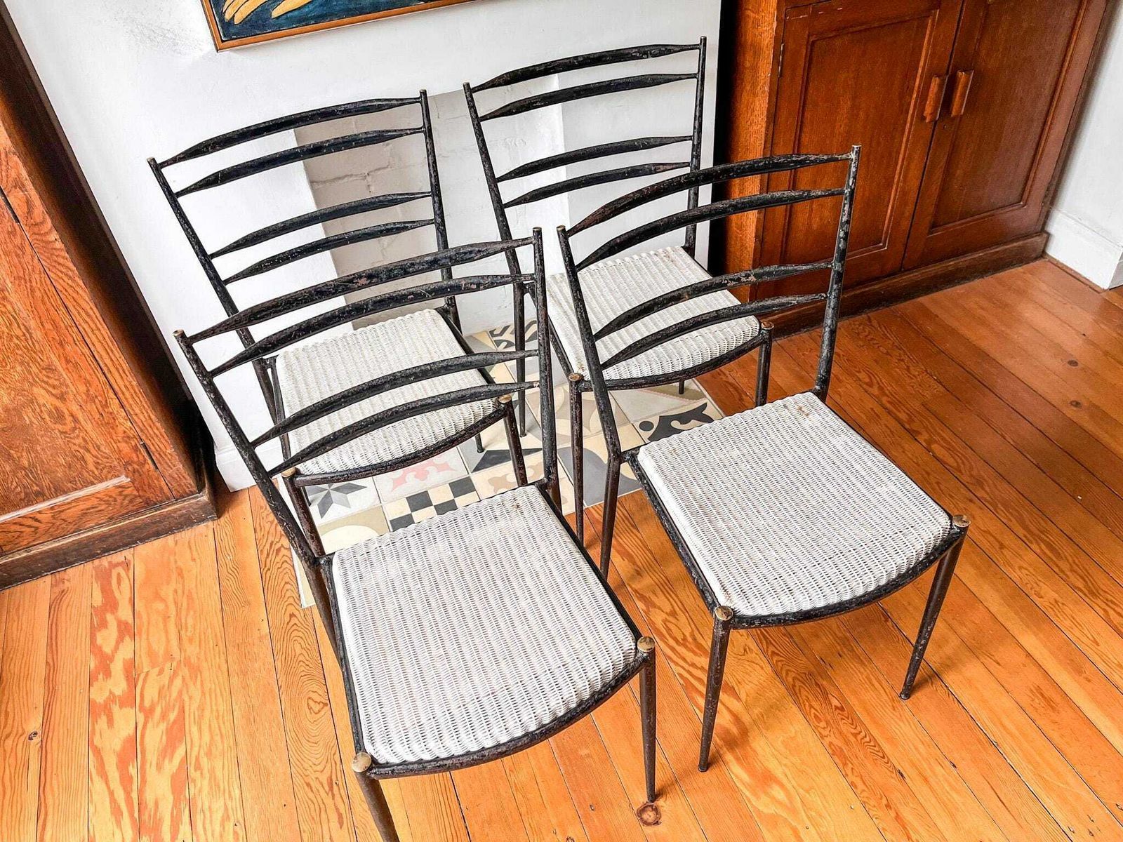 A Set Of Four Mid Century Metal And Wicker Dining Chairs By Lloyd Loom photo for sale